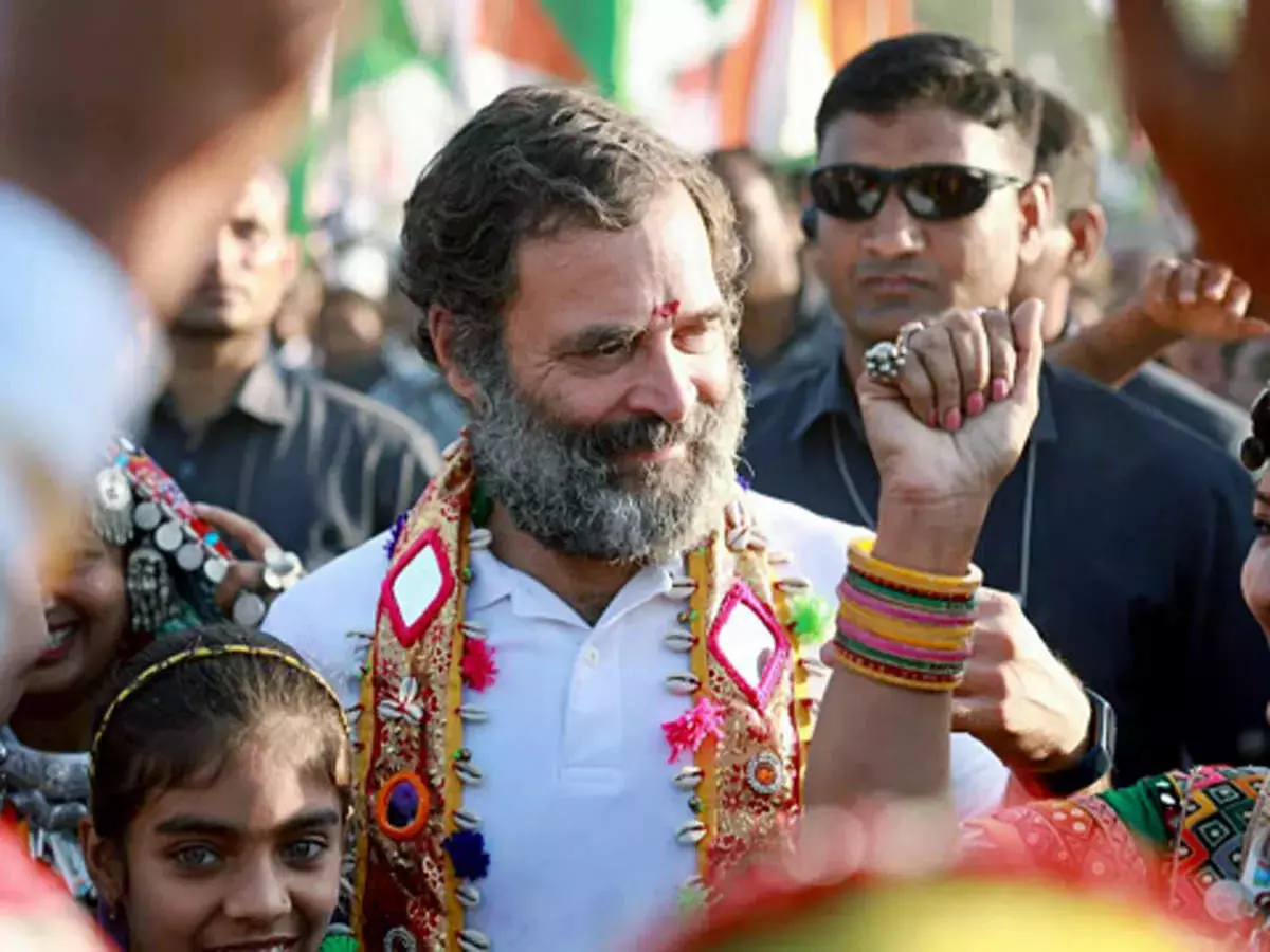 Rahul Gandhi interacts with porters at Anand Vihar railway station