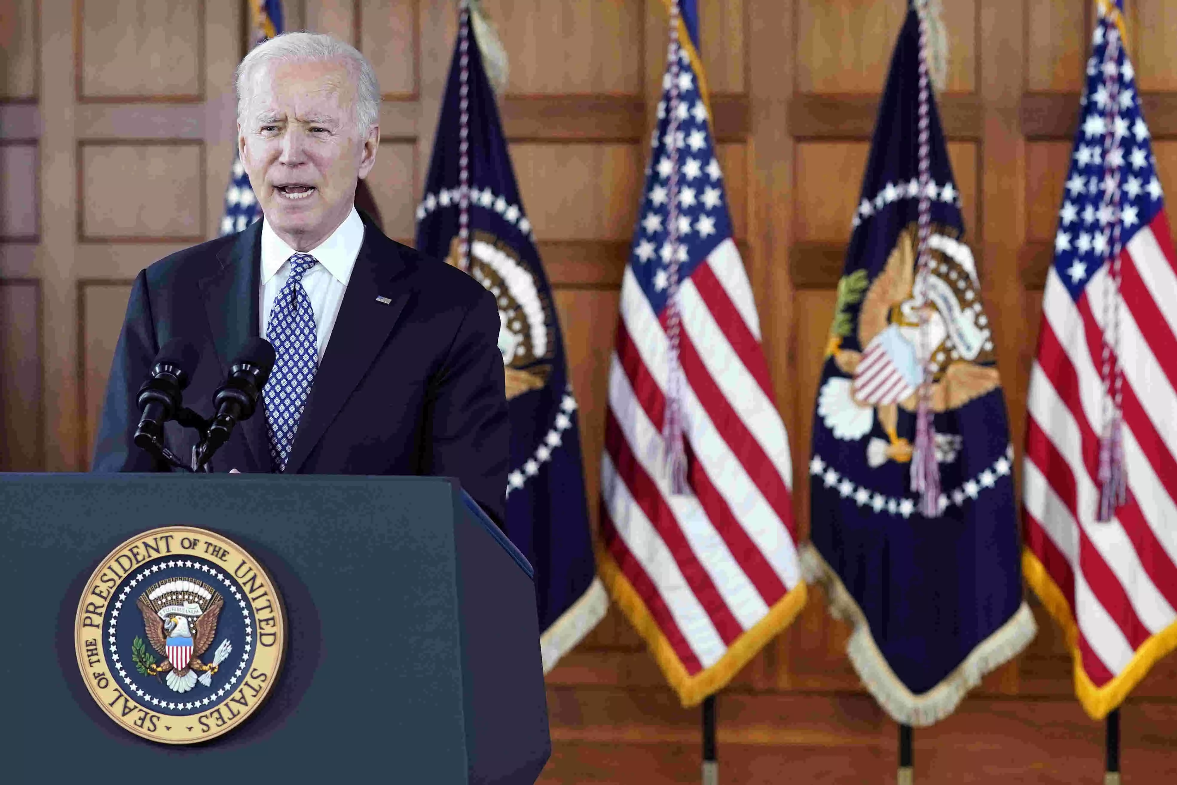 Government shutdown averted with little time to spare as Biden signs funding before midnight