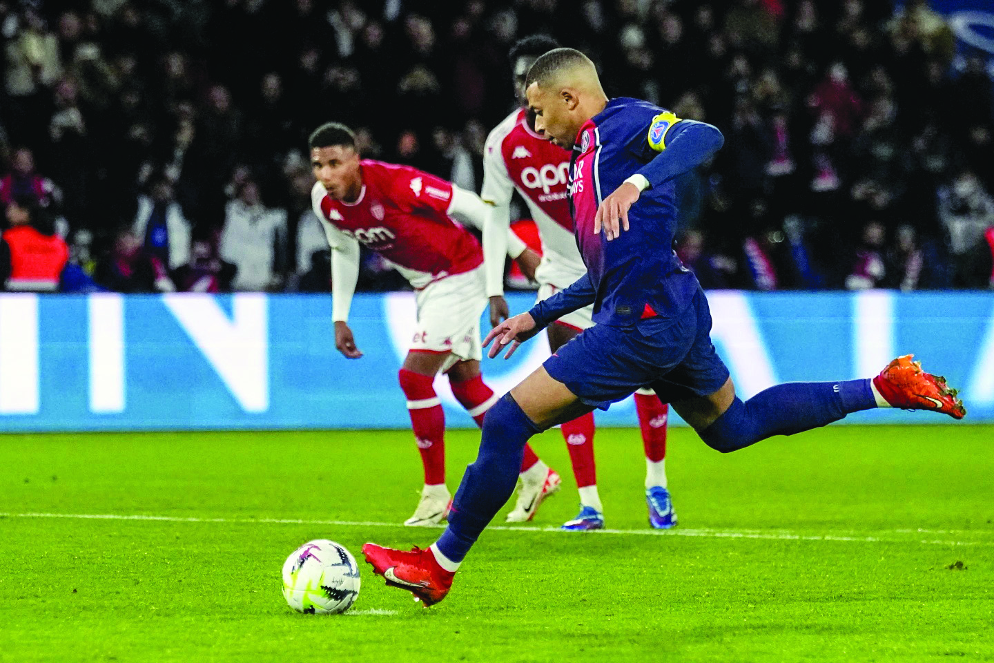 Mbappe scores a penalty as PSG beats Monaco 5-2 to move four points clear at the top