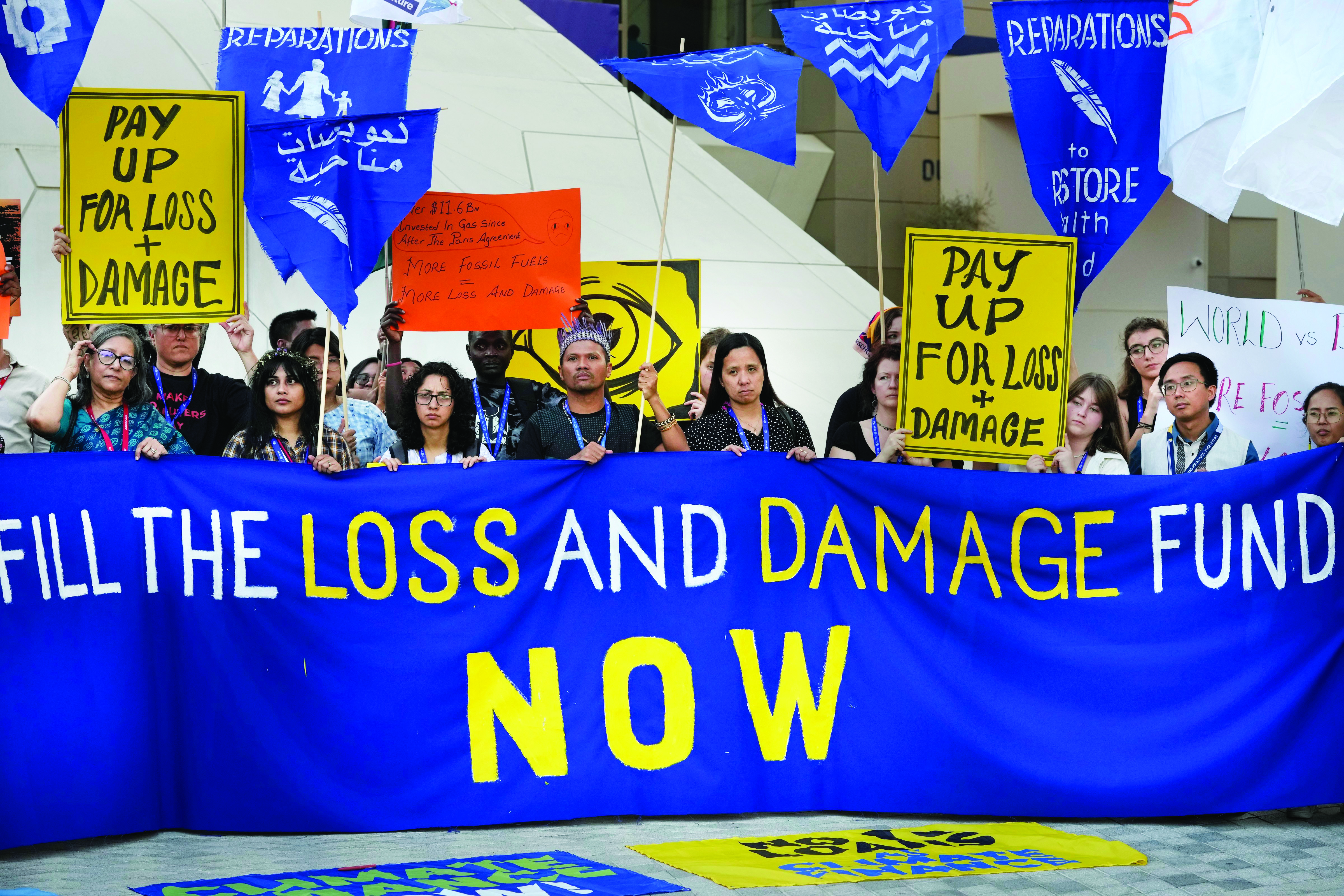 UN climate talks now in murky middle of hope, roadblocks