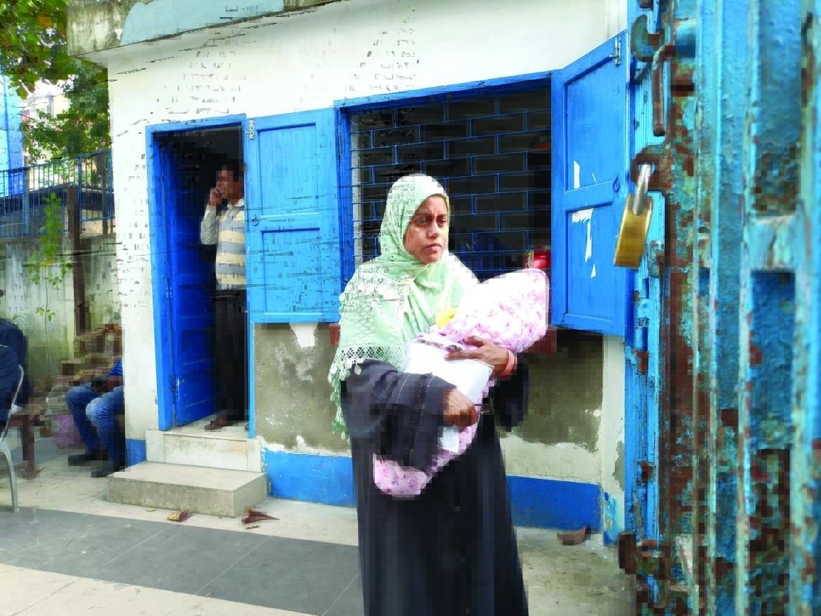 Woman appears for TET with her 2-month-old child