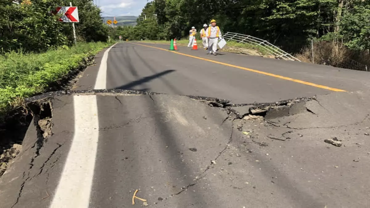 Rescuers race against time in search for survivors in Japan after powerful quakes leave 62 dead