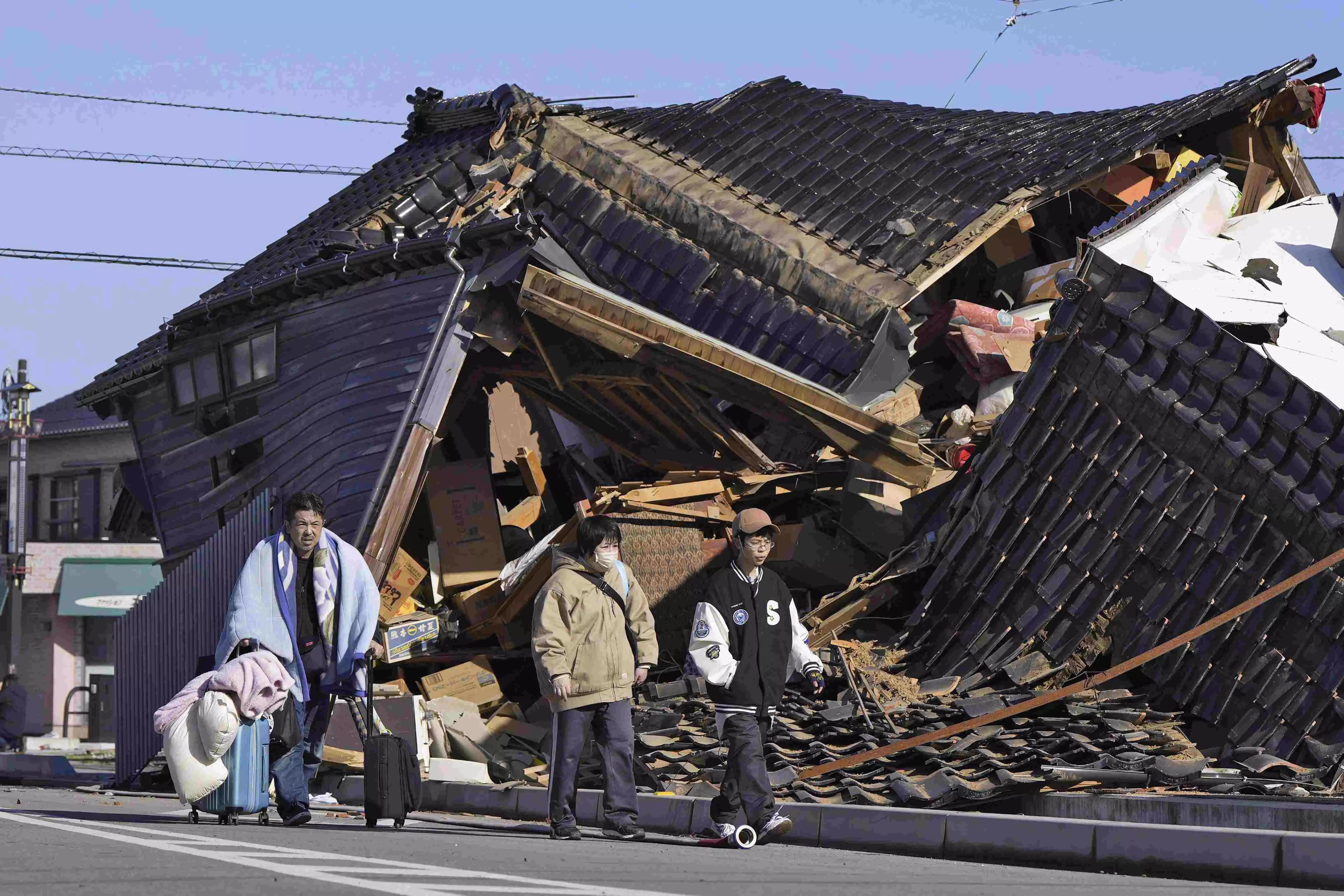 Snow hinders rescues and aid deliveries to isolated communities after Japan quakes kill 126 people