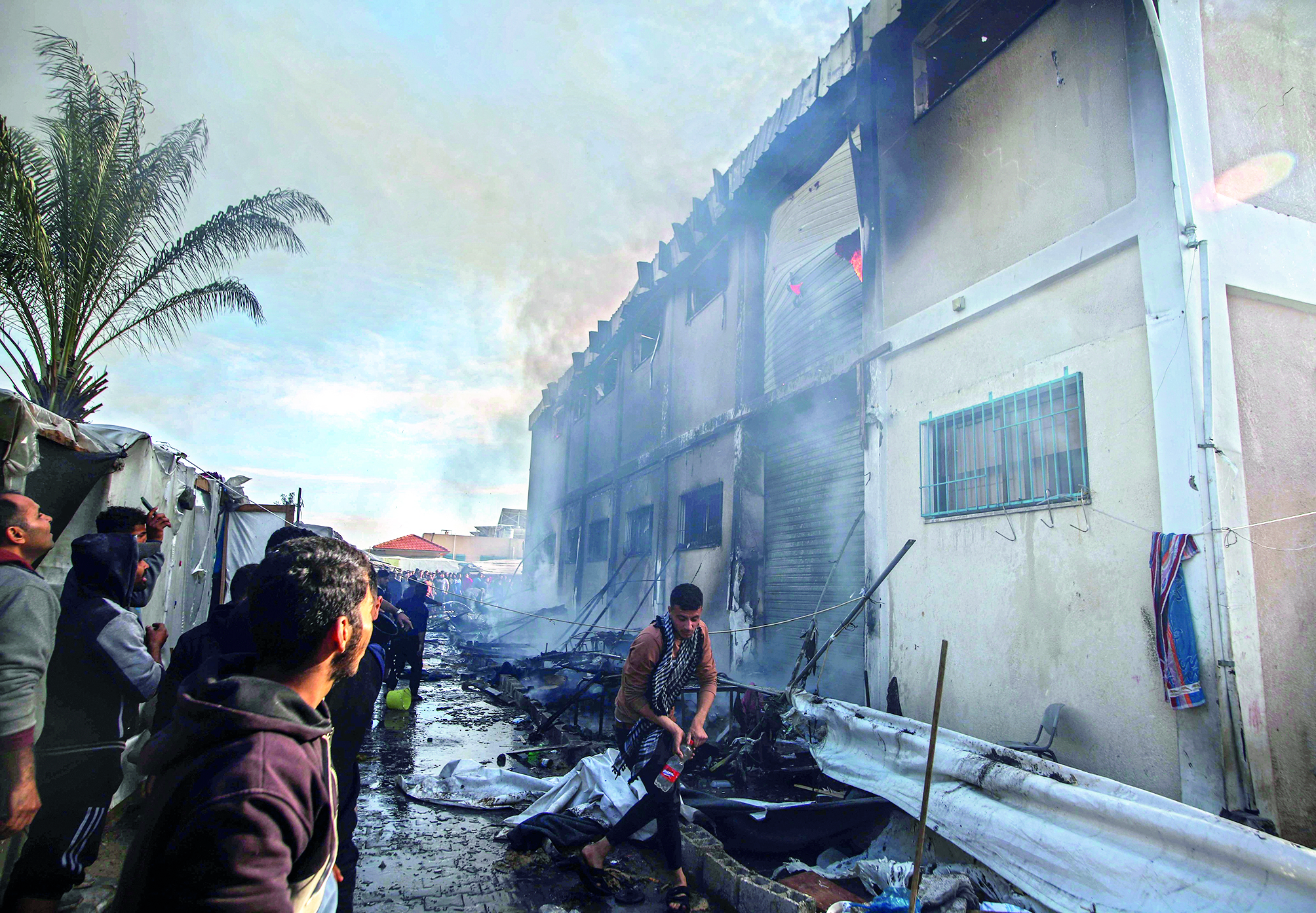 ‘At least 20 killed as Israeli fire strikes a crowd waiting for aid’