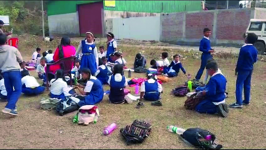 Parents lock door of school, classes held outside