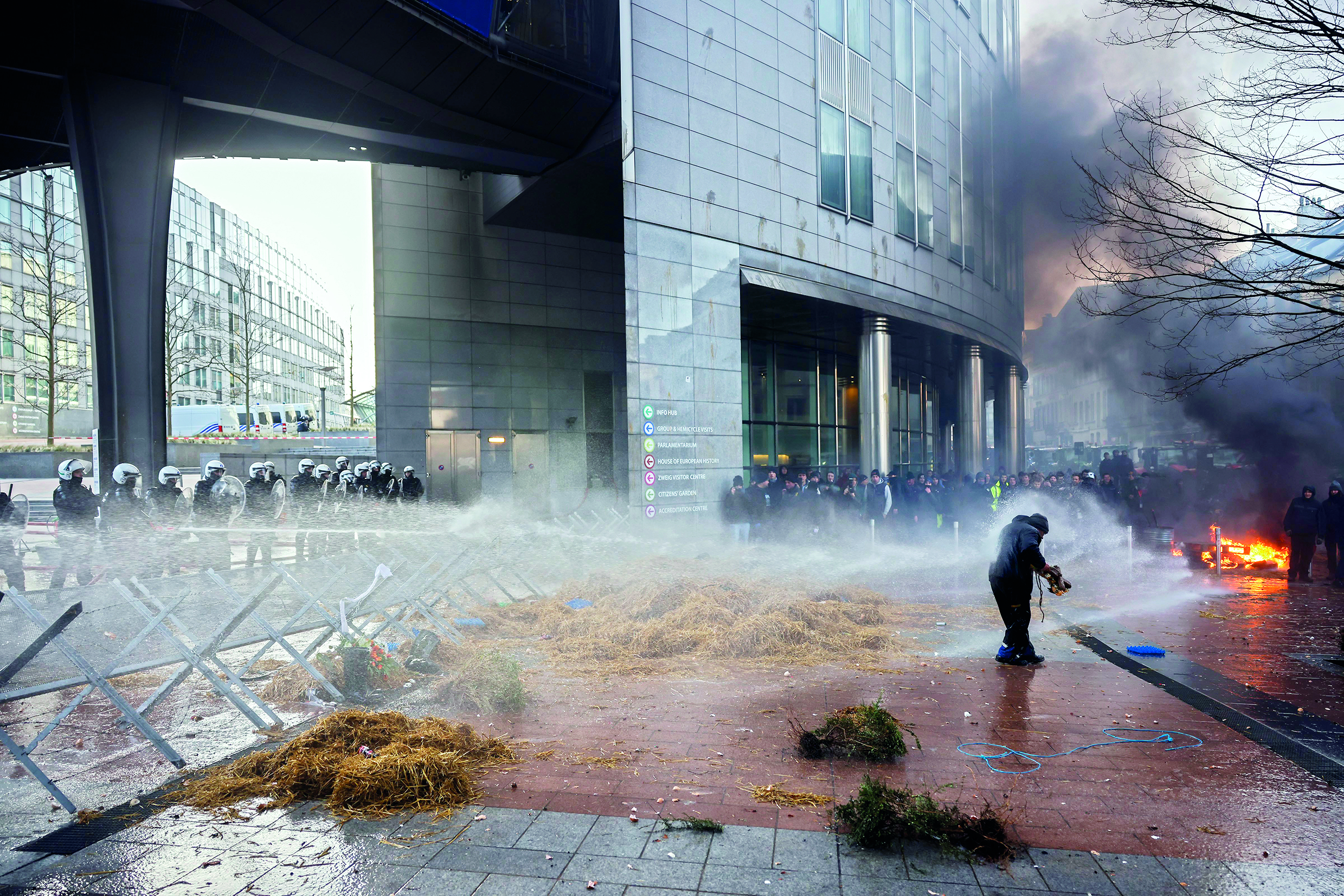 Farmers on tractors create chaos outside EU summit