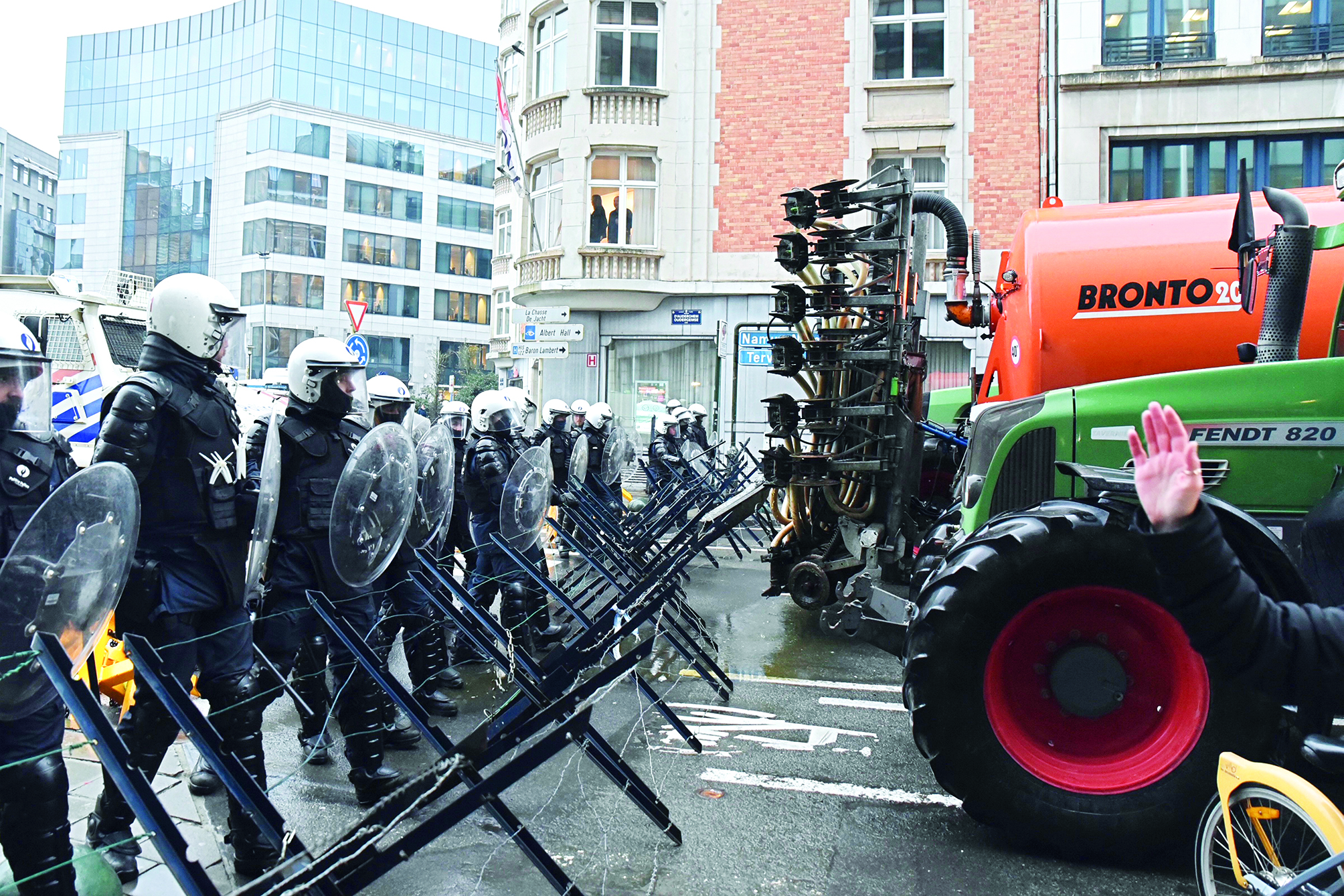 Angry farmers clash with police near EU’s headquarters