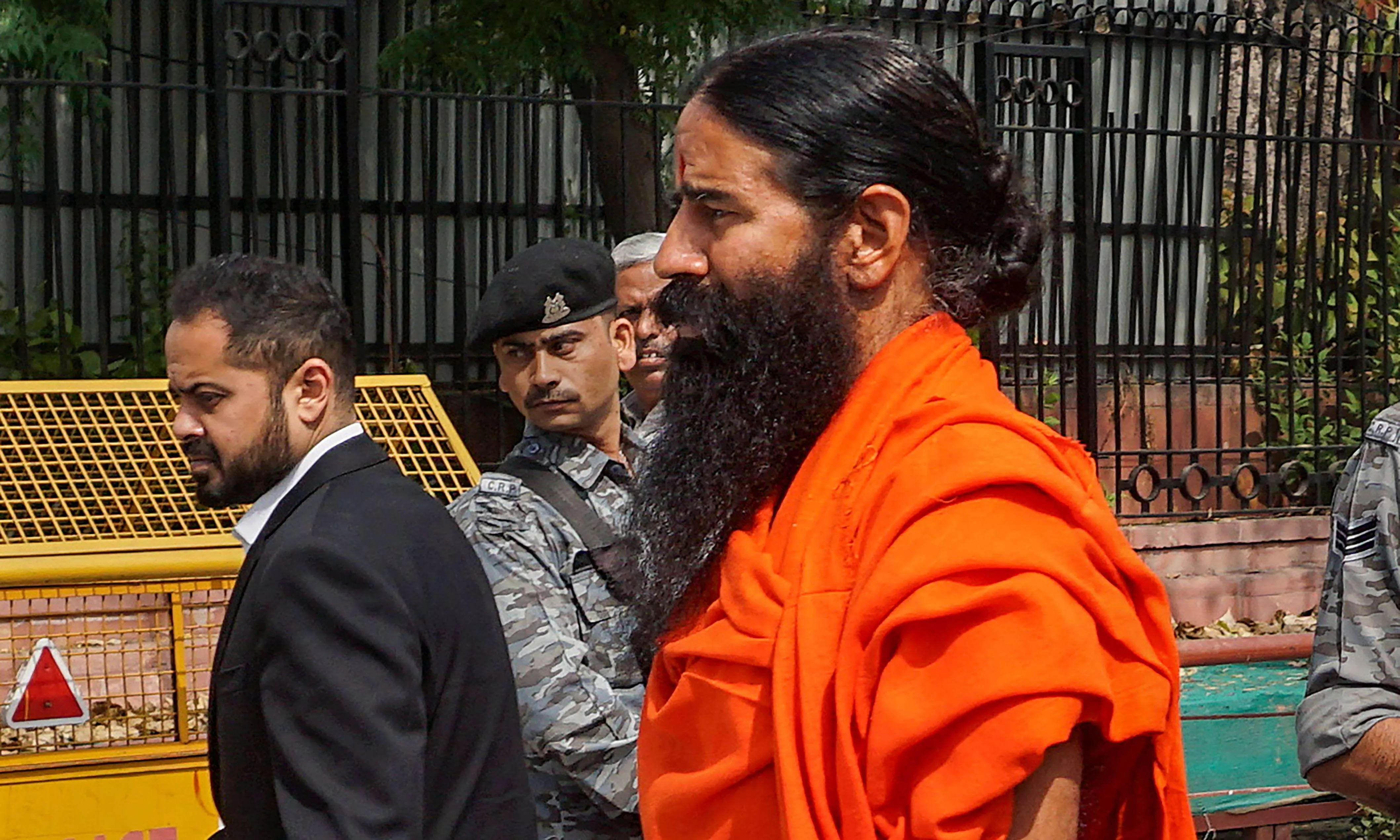 SC asks Ramdev, Balkrishna to issue public apology