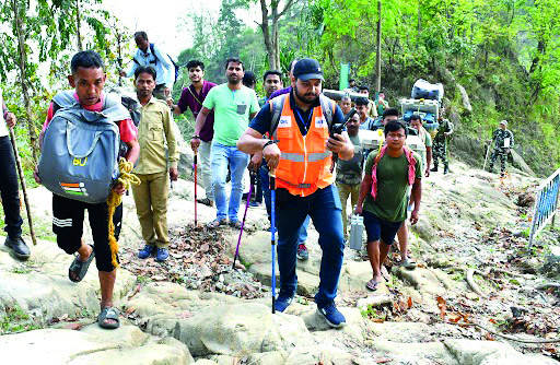 Polling teams trek through Buxa Hills for LS elections Polling teams trek through Buxa Hills for LS elections