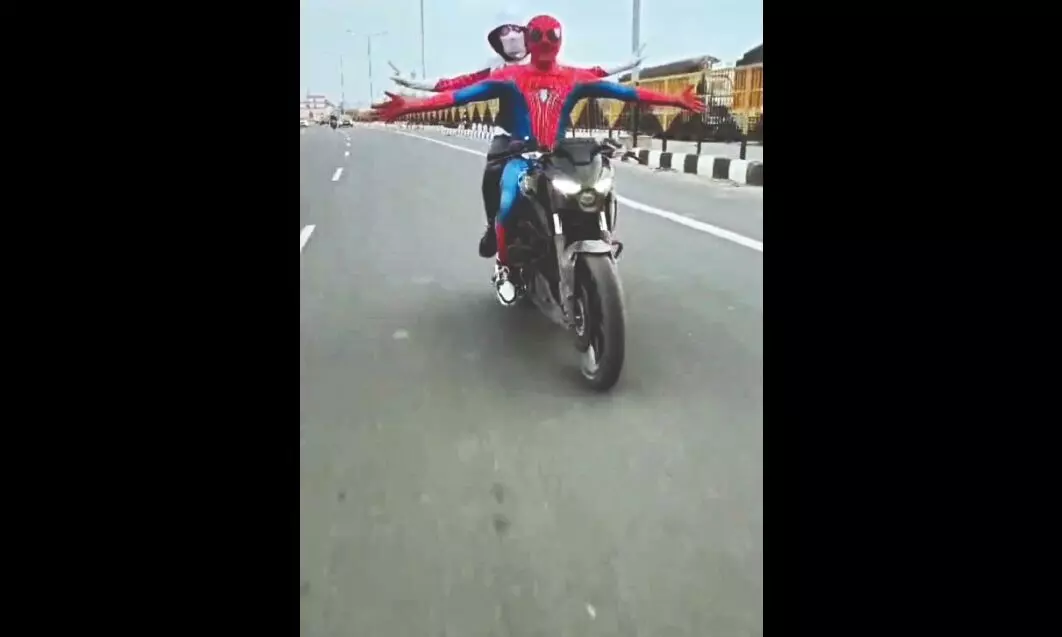 Spiderman takes Spiderwoman on a bike ride, both arrested