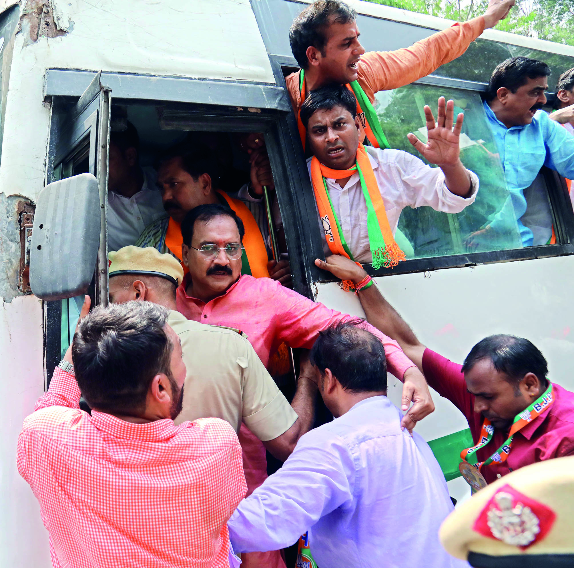 Delhi BJP slams AAP over NIA probe recommended by L-G, stages protest near party office