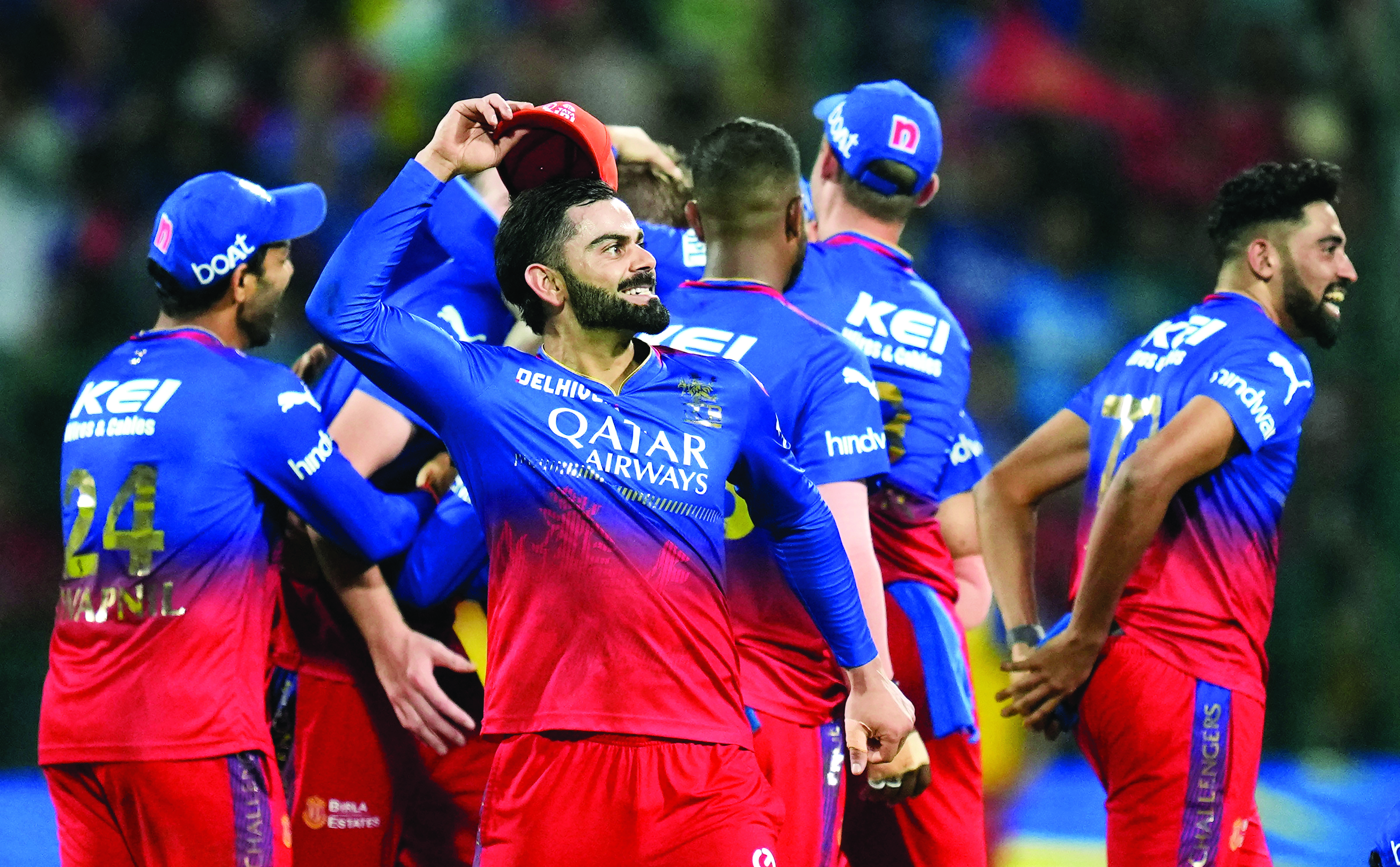 Patidar fifty, gritty bowlers keep RCB in playoff race