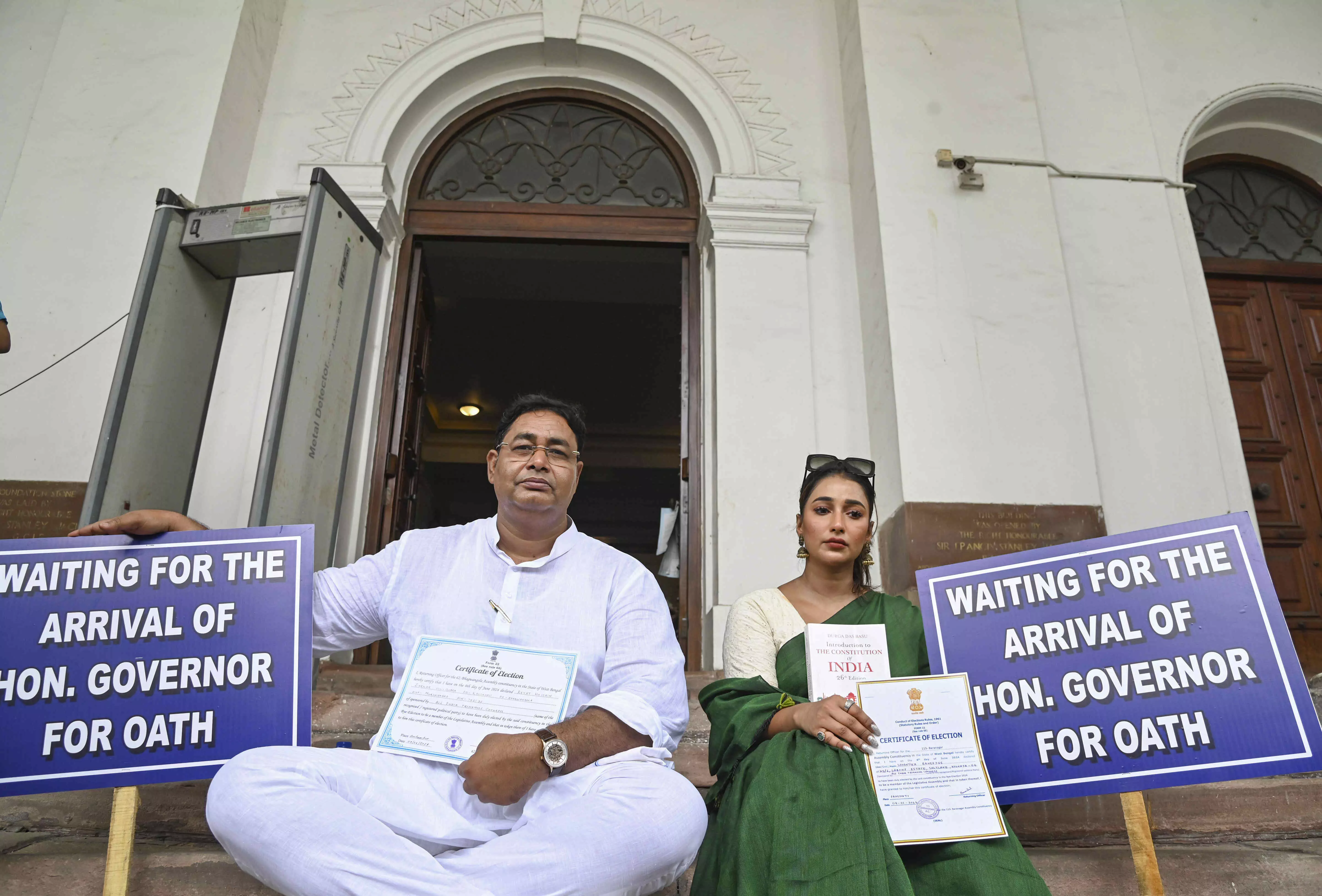 Stalemate over 2 newly-elected TMC MLAs oath taking continues as they sit on dharna for second day Stalemate over 2 newly-elected TMC MLAs oath taking continues as they sit on dharna for second day