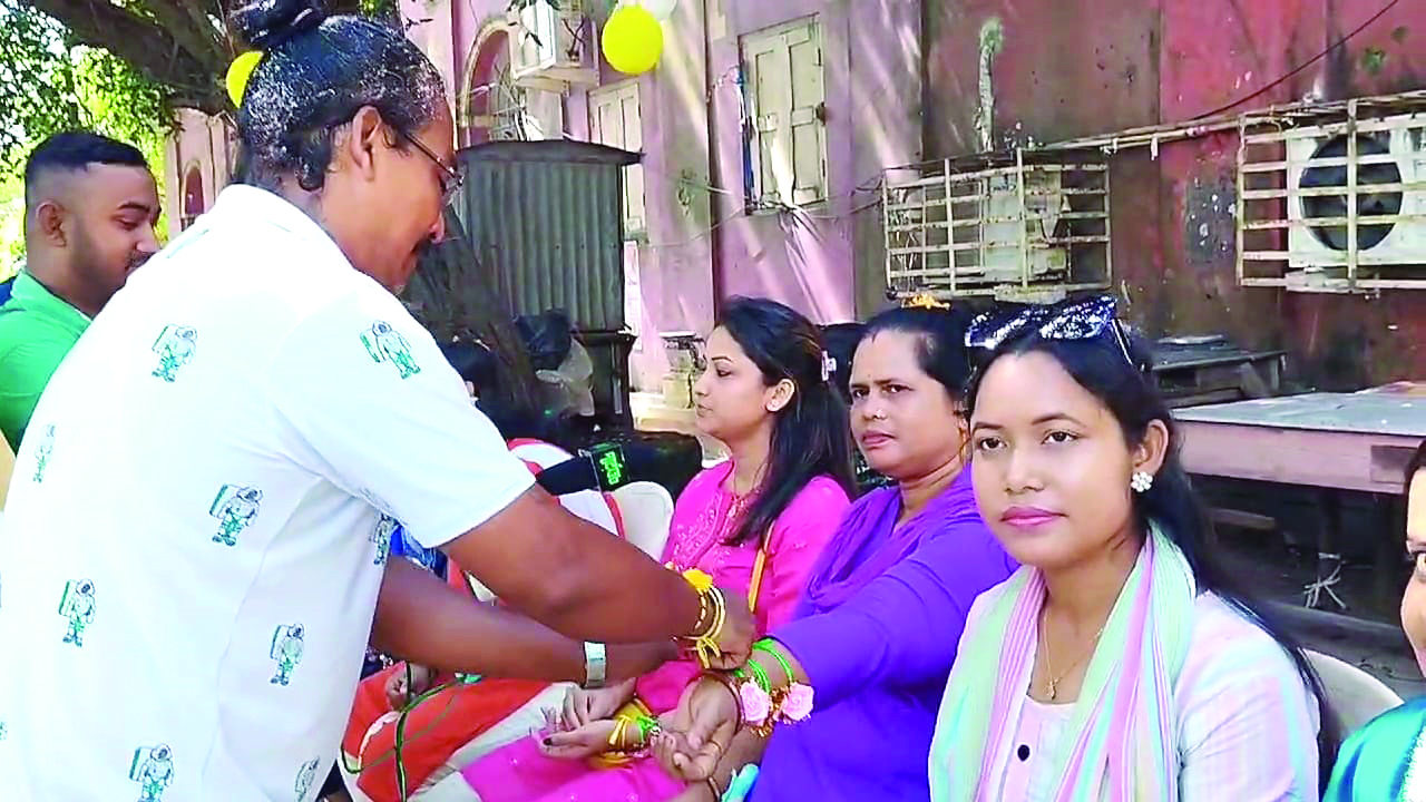 Brothers tie rakhi on their sister’s wrist
