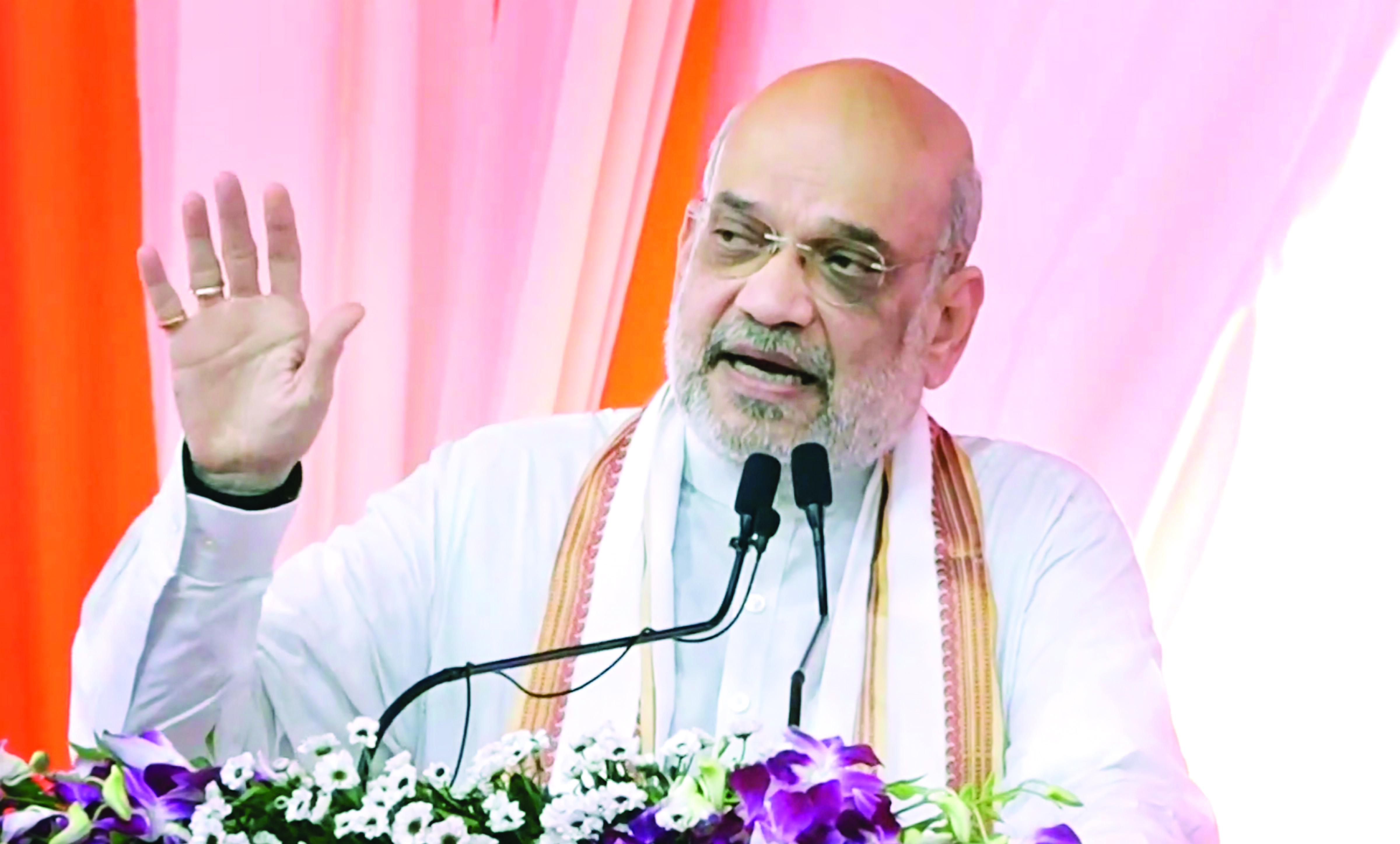 Shah distributes citizenship certificates to 188 refugees in Ahmedabad Shah distributes citizenship certificates to 188 refugees in Ahmedabad