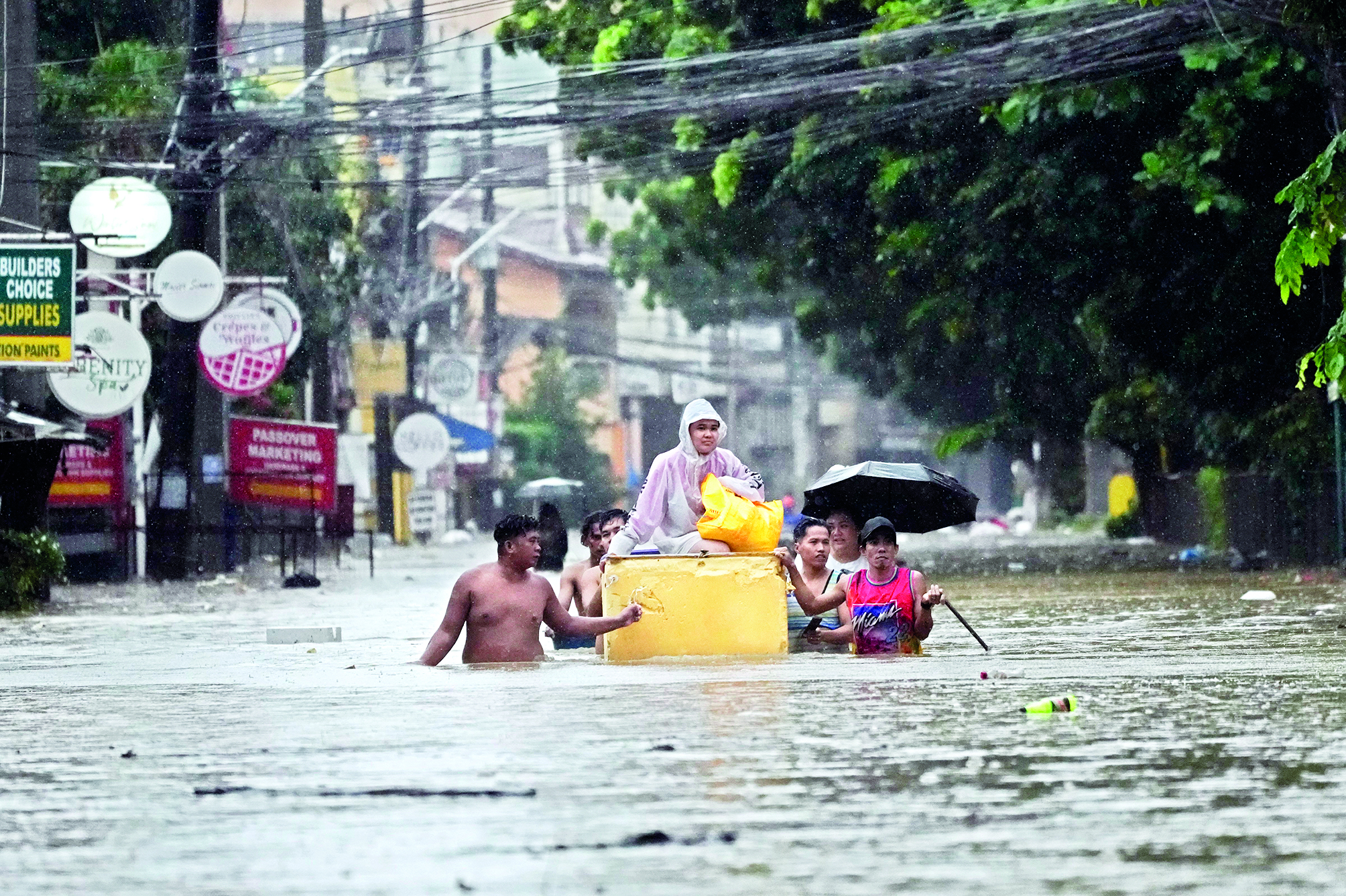 Storm sets off floods and landslides in Philippines, leaving at least 14 dead
