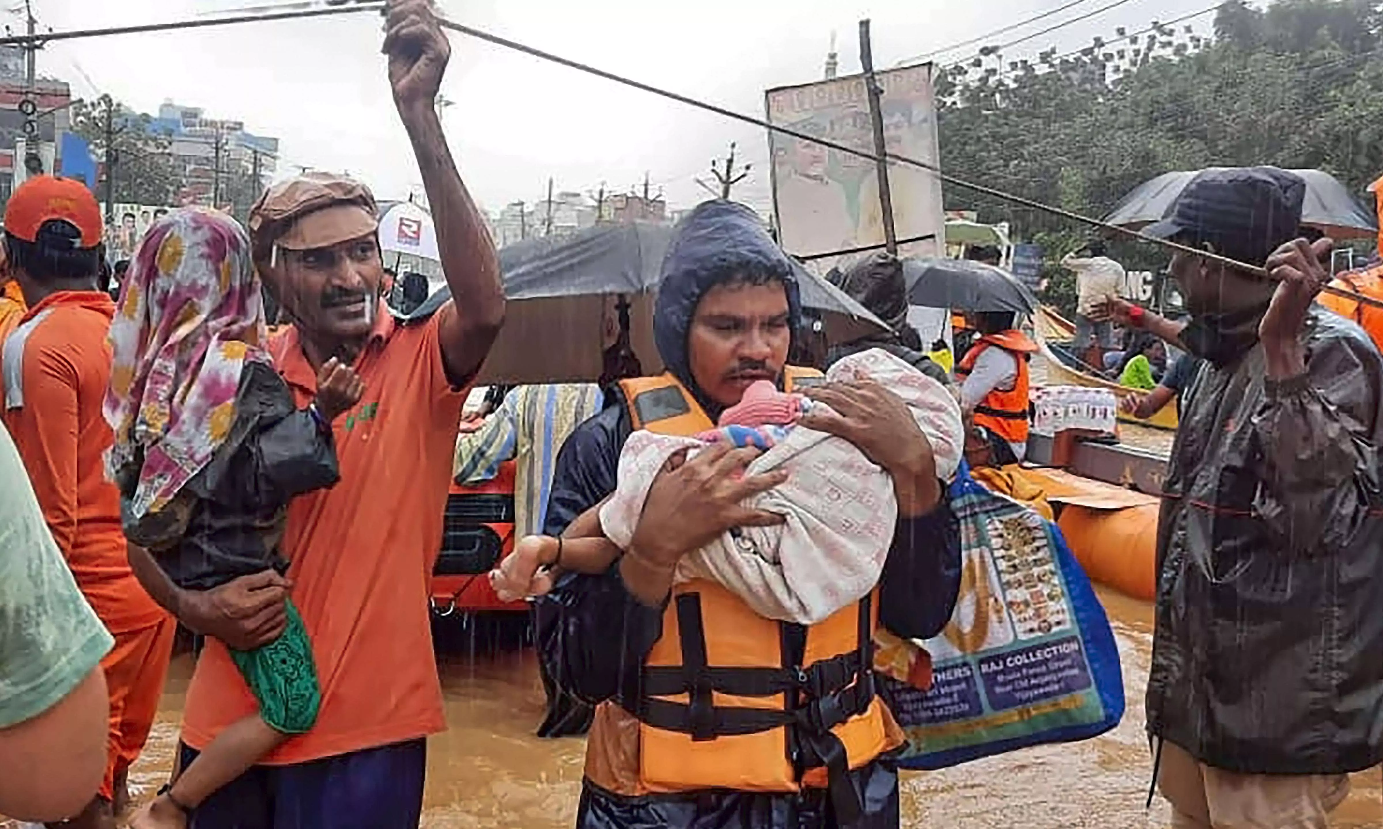 Scores scramble for food, milk in Vijayawada; complain over alleged govt apathy Scores scramble for food, milk in Vijayawada; complain over alleged govt apathy