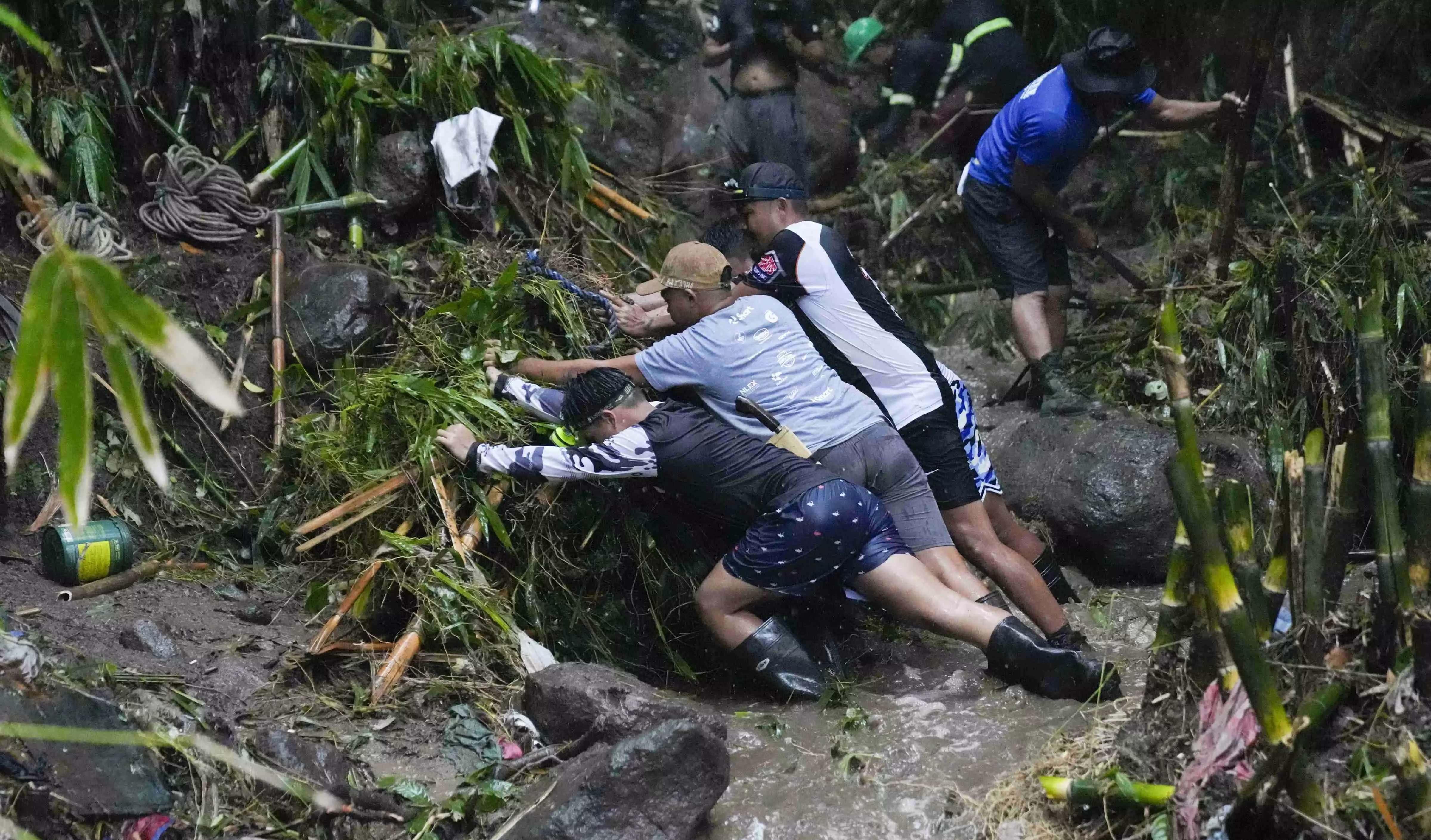 Flooding sweeps away bus and bridge collapses in Vietnam as storm deaths rise to 59