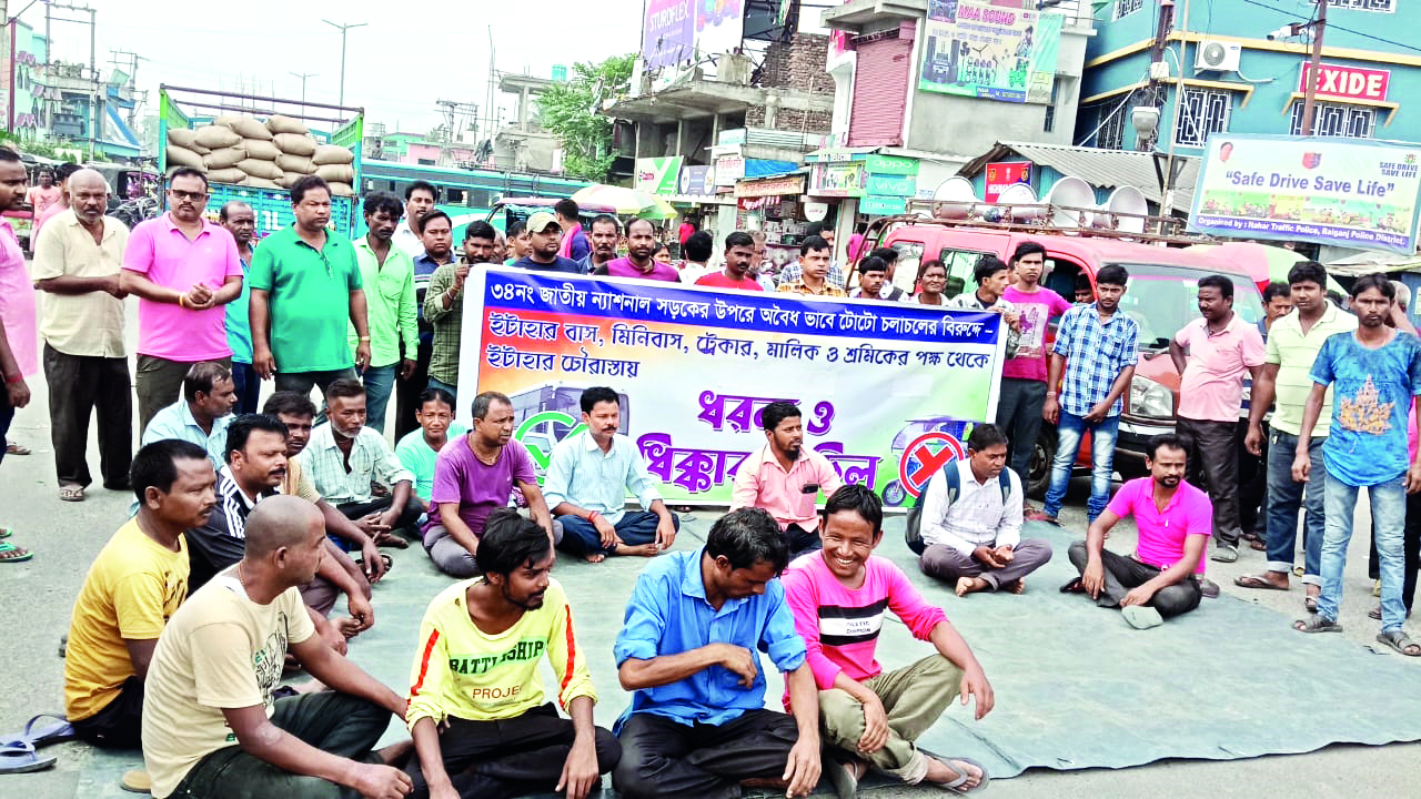 Bus and trekker owners block road Bus and trekker owners block road