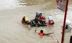 Tropical storm battering Philippines leaves at least 23 people dead in flooding and landslides