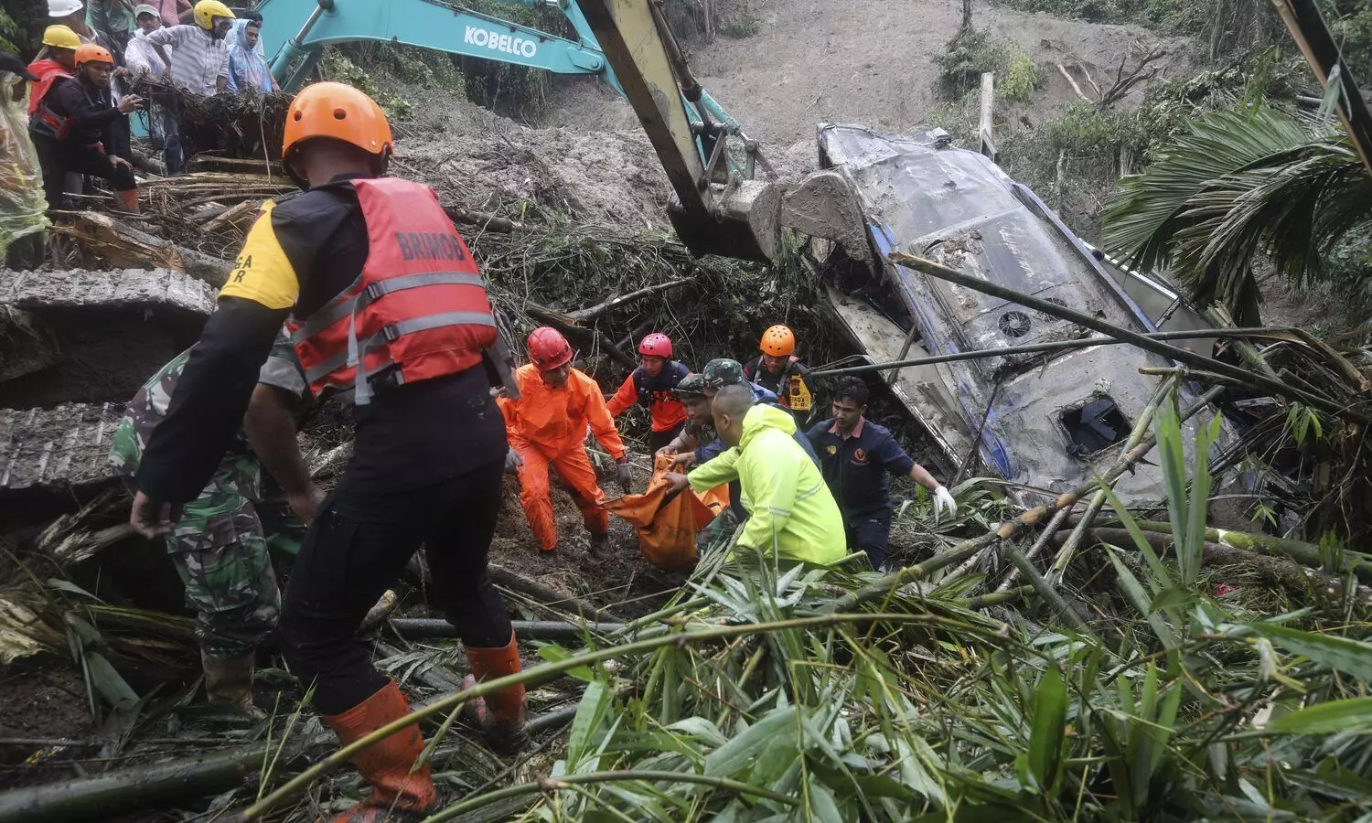 Landslide triggered by rain in Indonesias Sumatra island kills 9 people in tourist bus