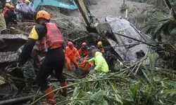 Landslide triggered by rain in Indonesias Sumatra island kills 9 people in tourist bus