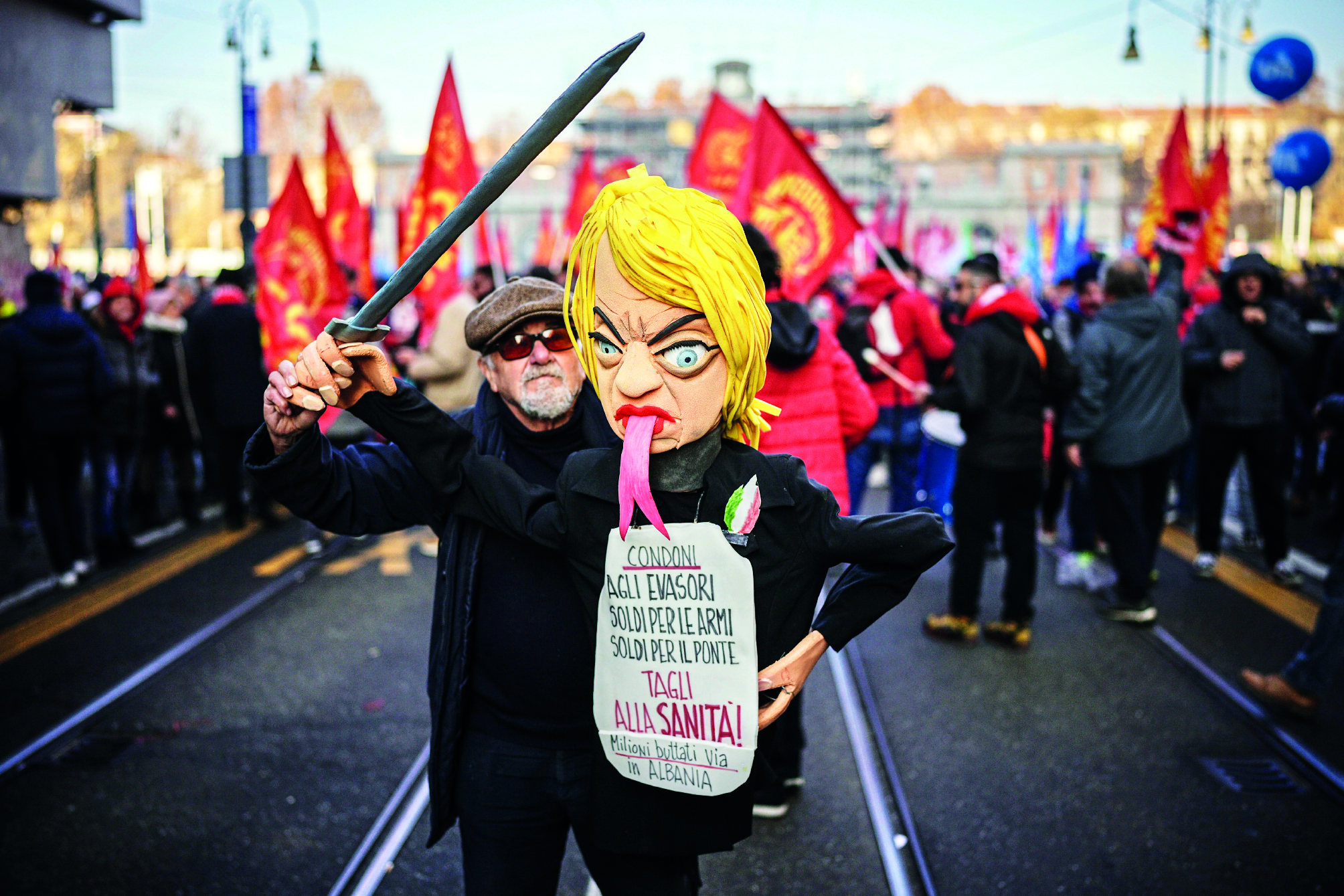Thousands of workers march across Italy in general strike