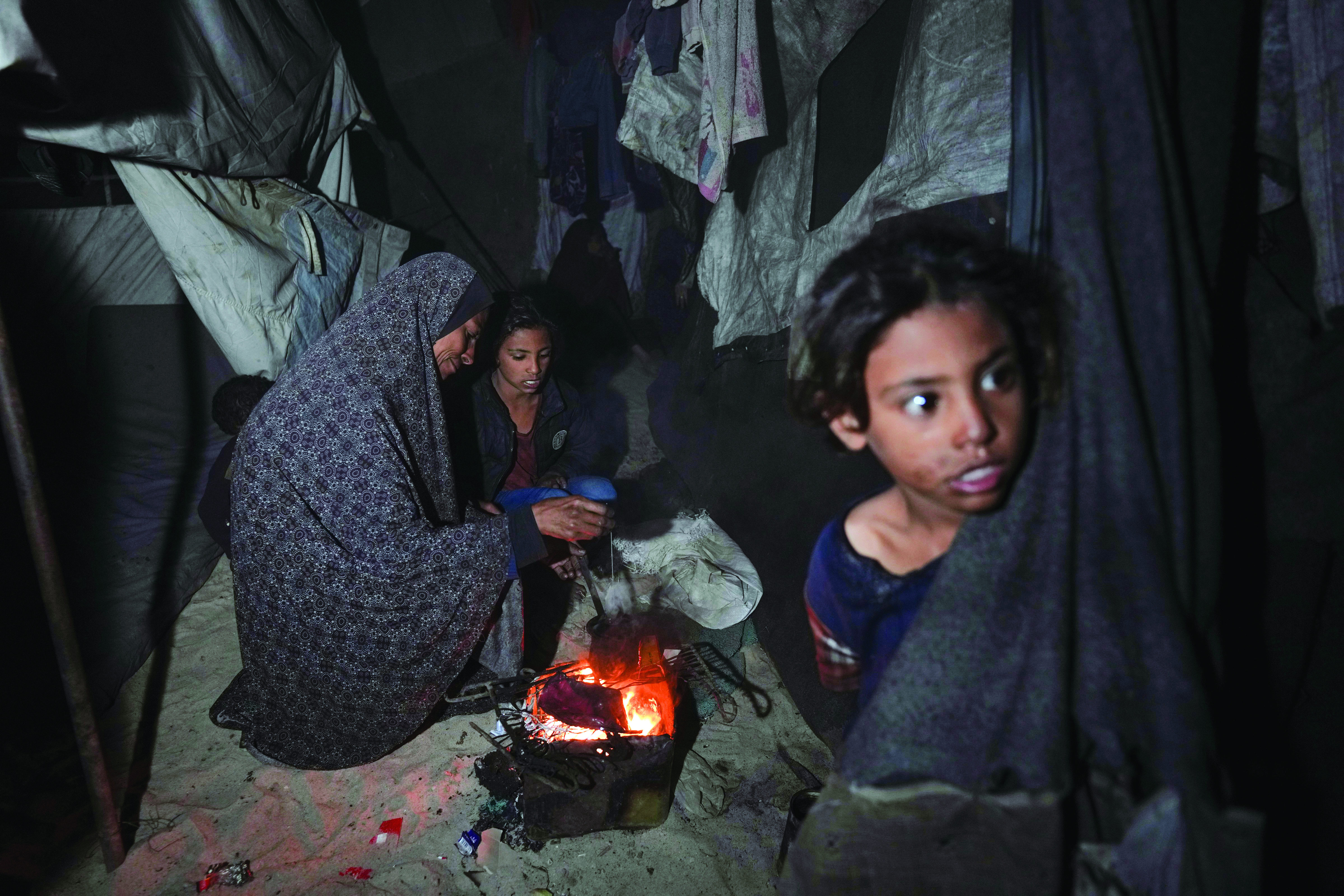 UN halts aid shipments through Gaza’s main crossing after looting