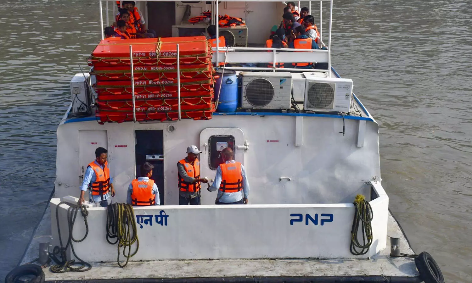 Navy helicopter, boats looking for 2 missing after ferry-craft collision