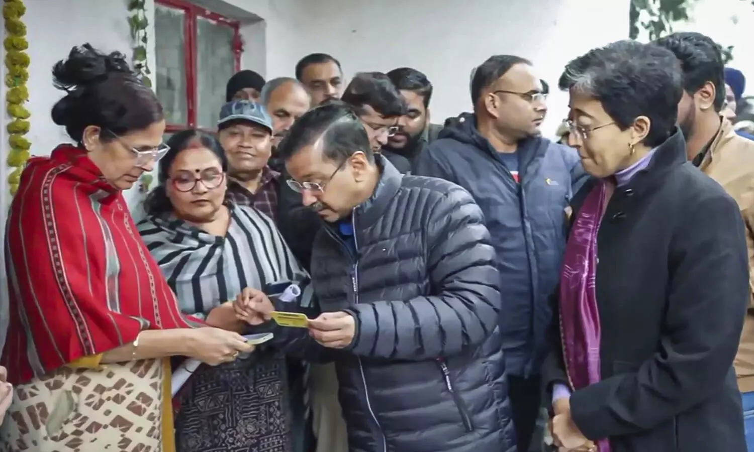 Ahead of Delhi polls, Kejriwal helps women register for Mahila Samman Yojana