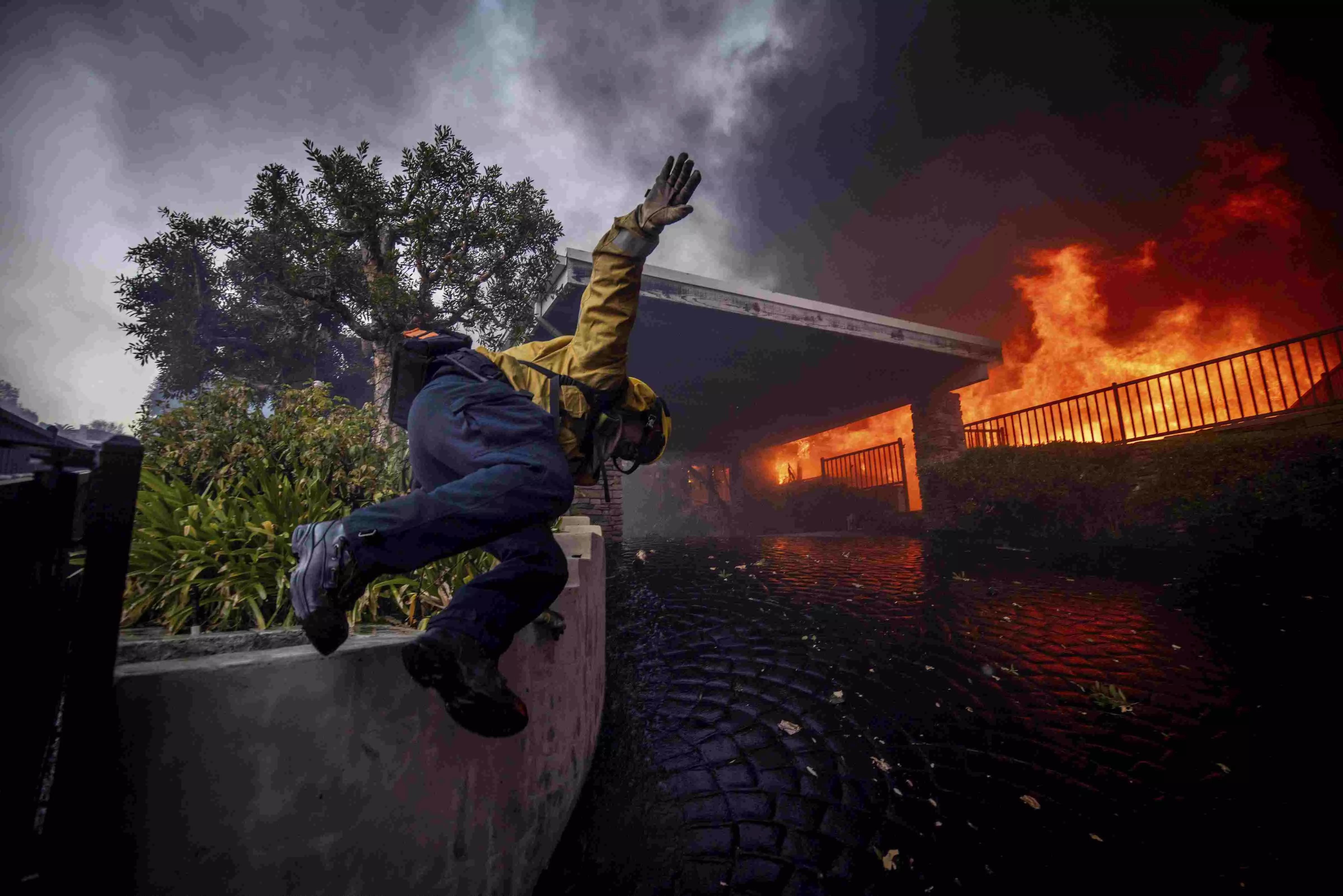 30,000 people under evacuation orders as wildfire whips through Los
