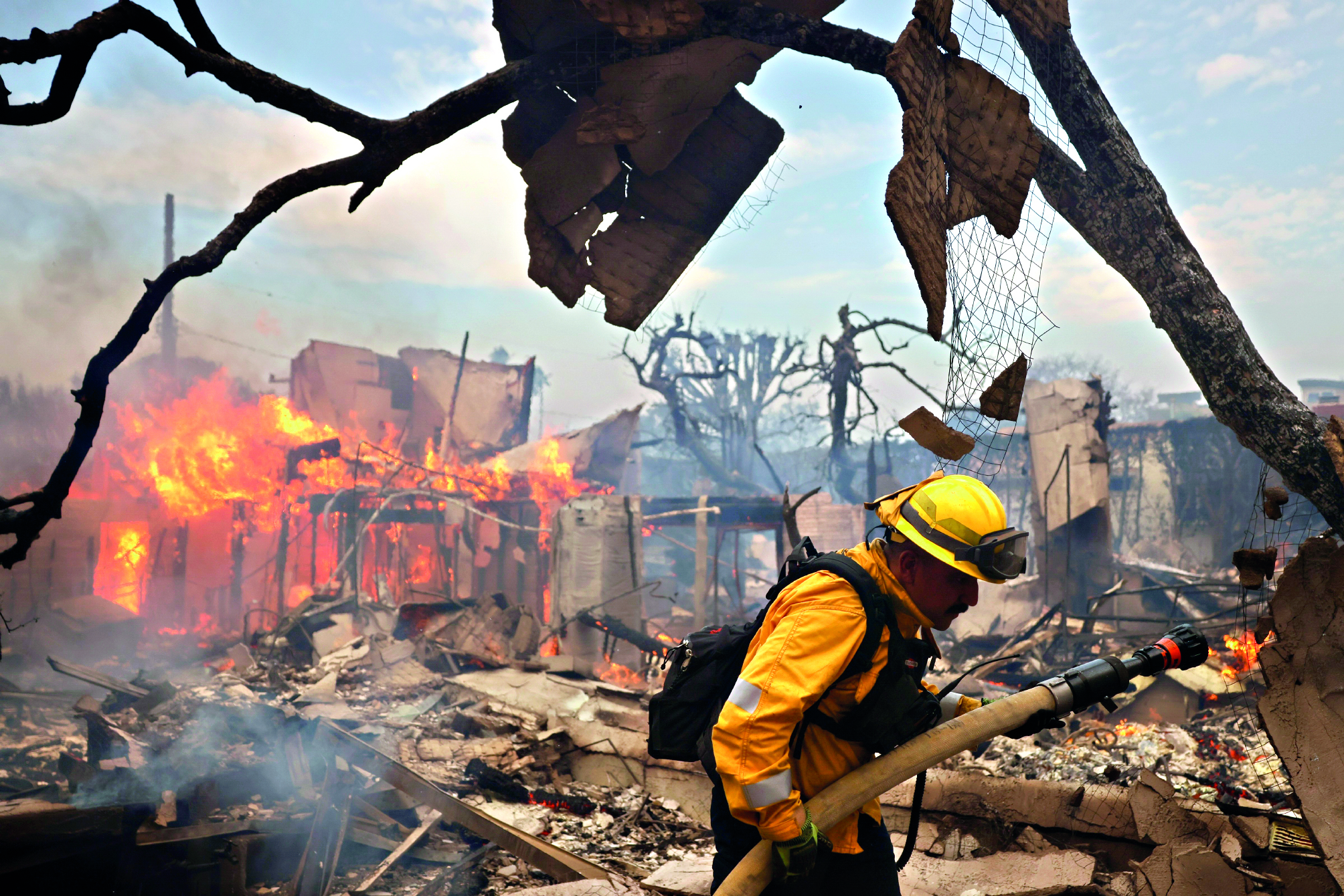 Los Angeles firefighters battle wildfires as communities burn