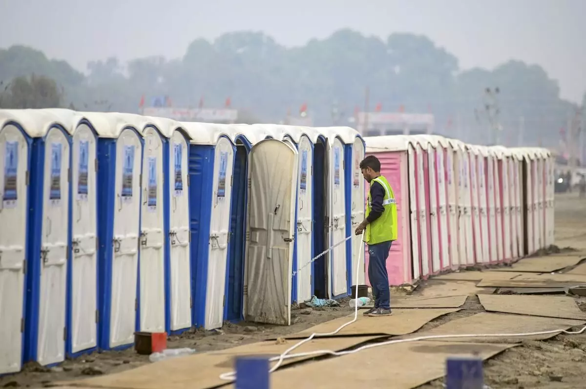 BJP distributes copies of Constitution to Maha Kumbh sanitation staff as parties try to woo Dalits BJP distributes copies of Constitution to Maha Kumbh sanitation staff as parties try to woo Dalits