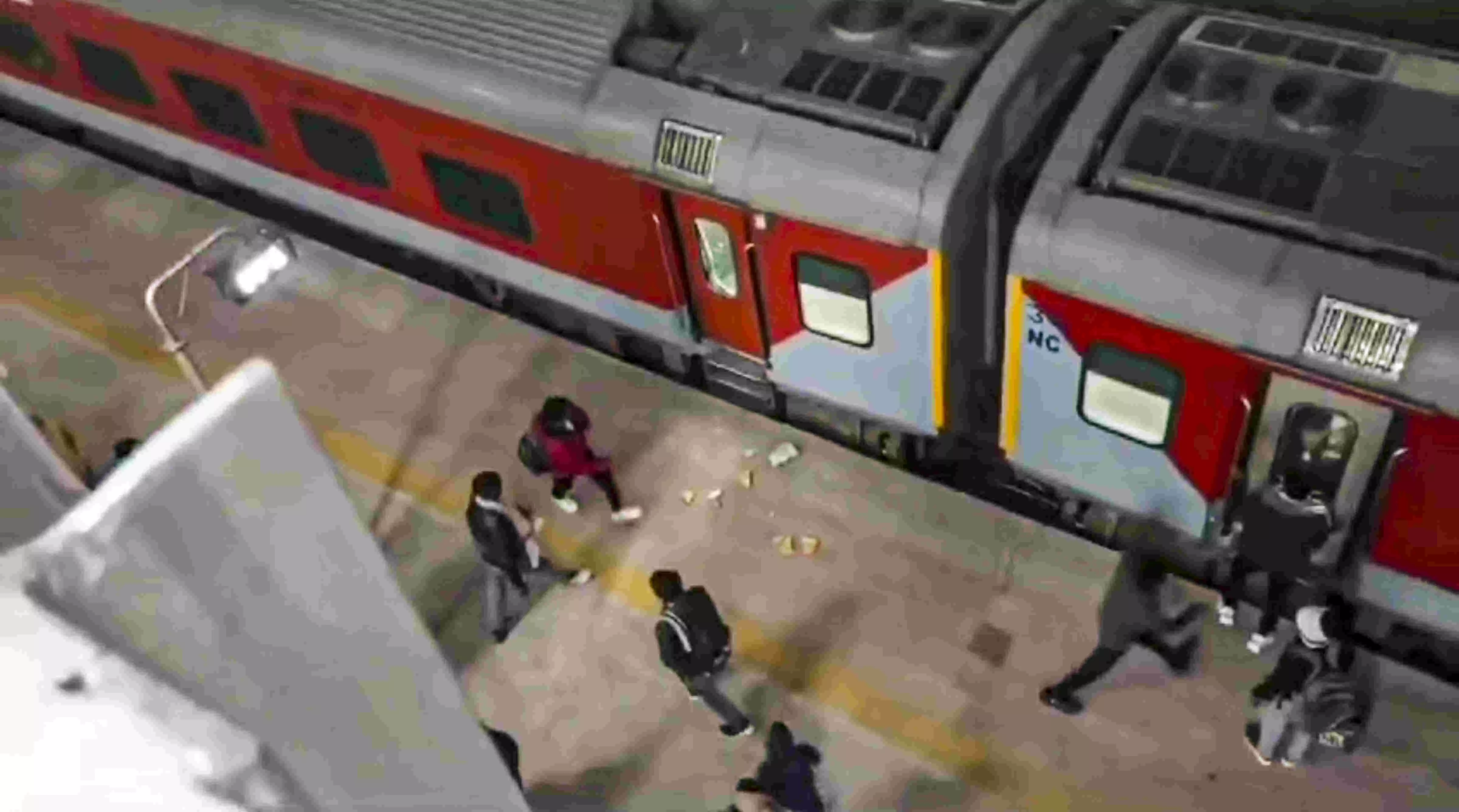 Kumbh-bound passengers hurl stones after being unable to board crowded trains in MP Kumbh-bound passengers hurl stones after being unable to board crowded trains in MP