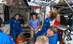 NASAs stuck astronauts welcome their newly arrived replacements to space station