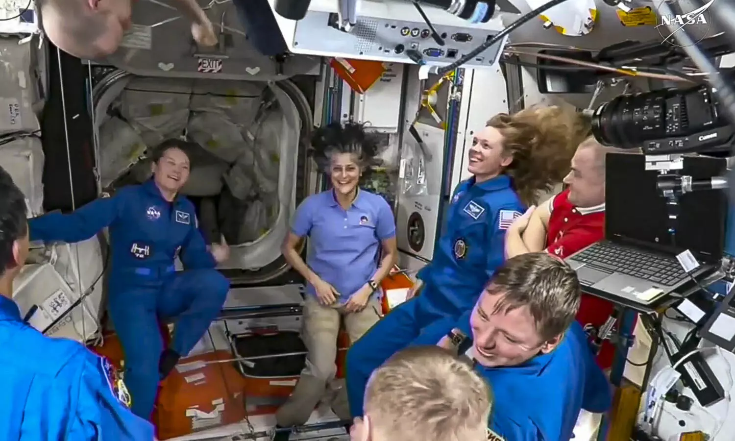 NASAs stuck astronauts welcome their newly arrived replacements to the space station