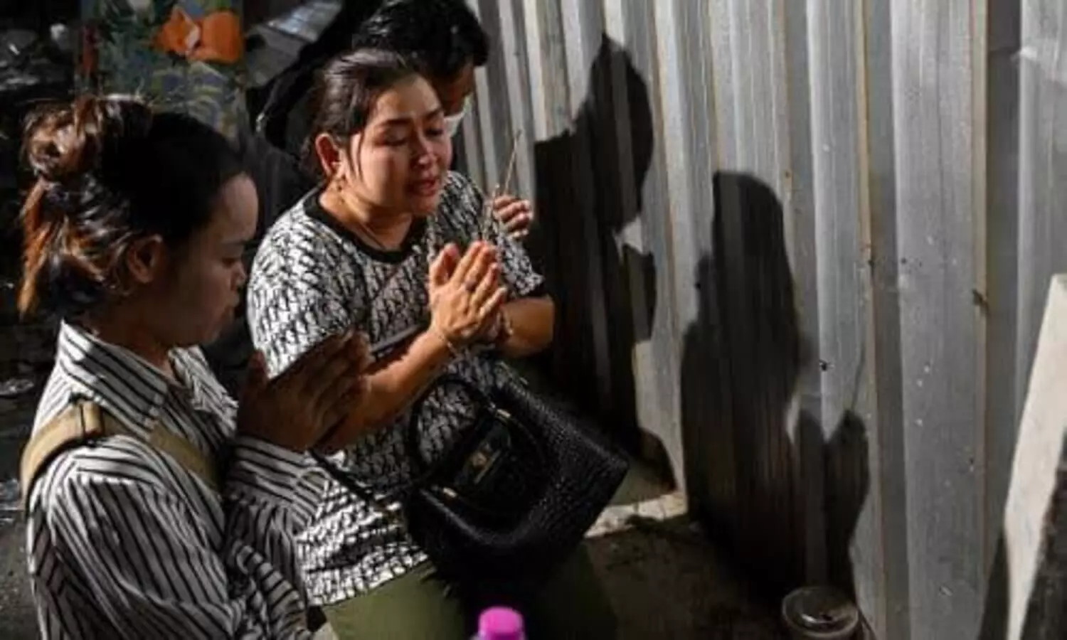Families awaits news of missing workers at site of Bangkok building collapse