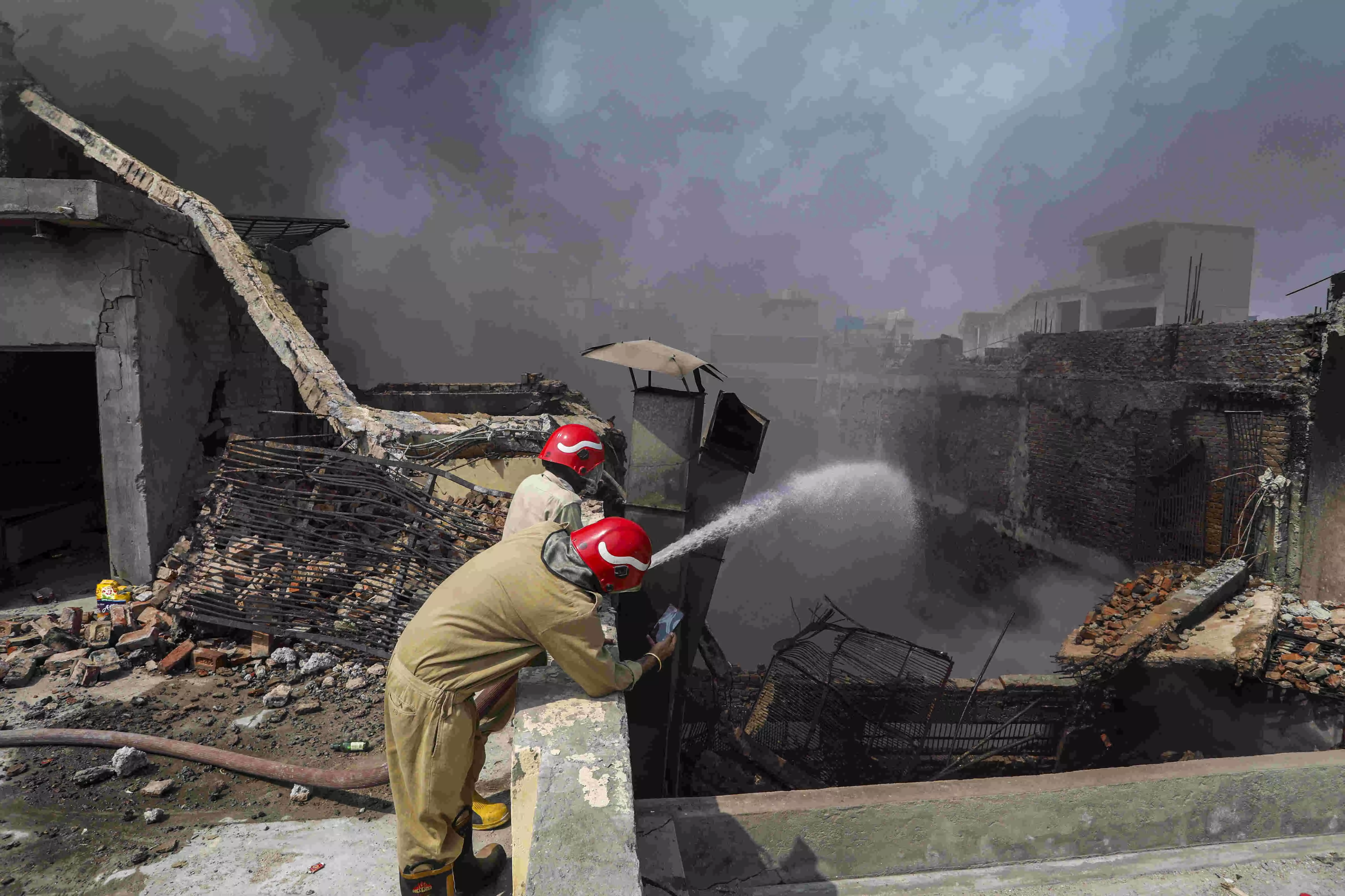 Building collapses after massive fire at factory triggers blast in Delhis Bawana Building collapses after massive fire at factory triggers blast in Delhis Bawana