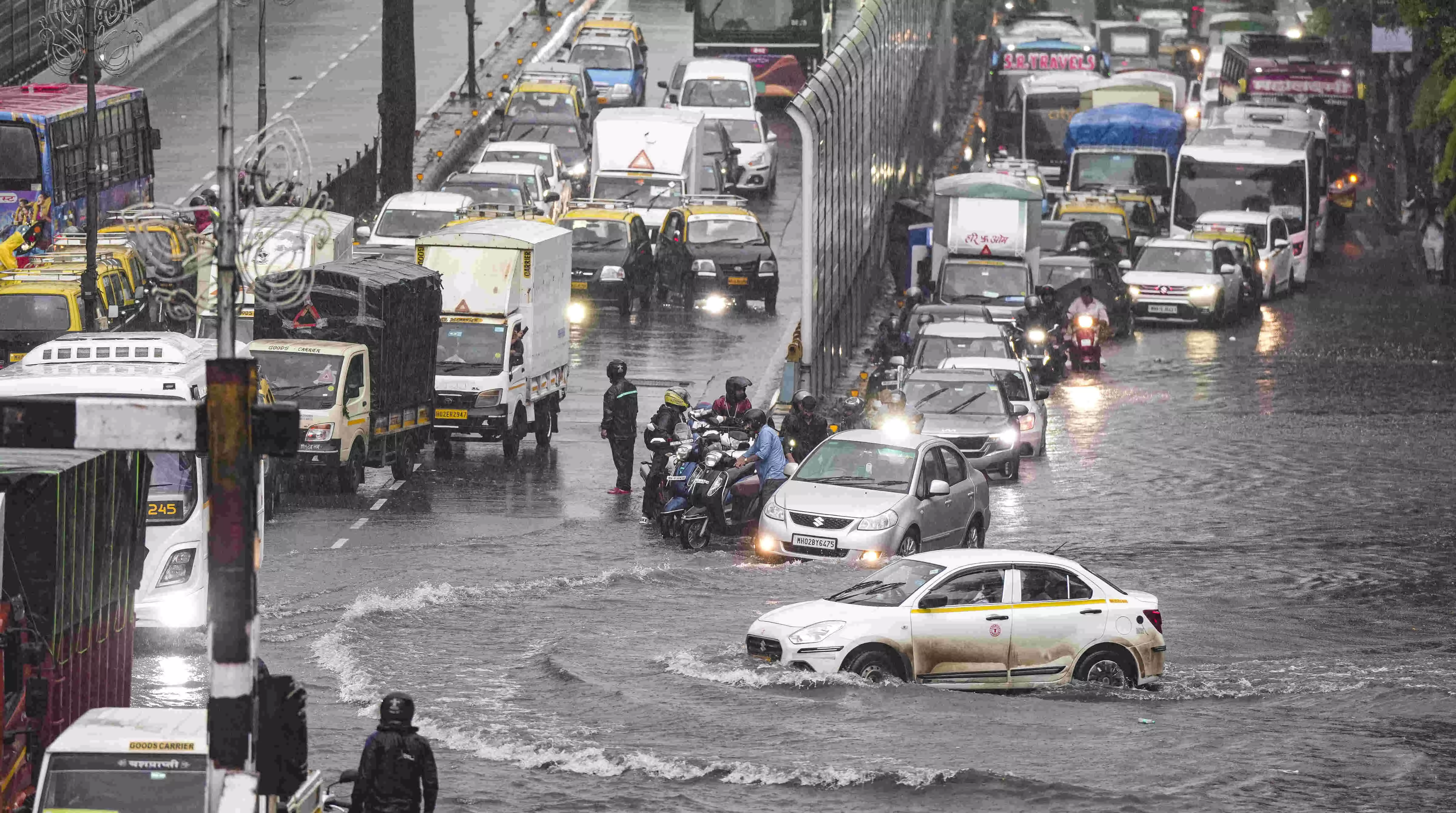Red alert in Mumbai | Rain causes chaos as monsoon arrives early; air, rail, road traffic hit