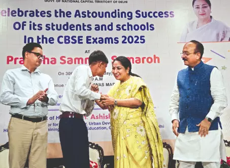 CM felicitates CBSE toppers of govt schools, distributes tablets CM felicitates CBSE toppers of govt schools, distributes tablets