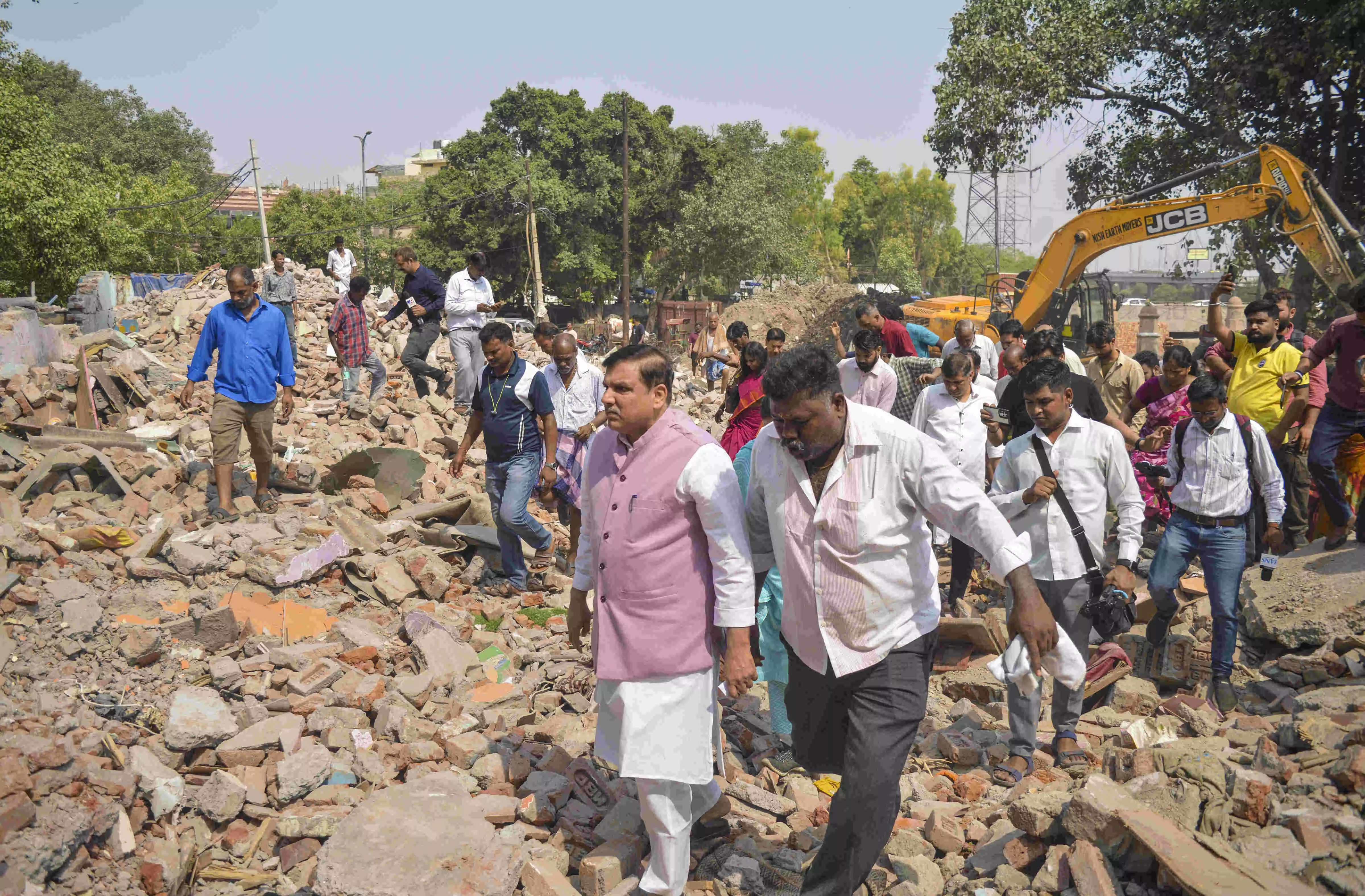AAP leaders visit Madrasi Camp demolition site, vow to fight for slum dwellers rights AAP leaders visit Madrasi Camp demolition site, vow to fight for slum dwellers rights