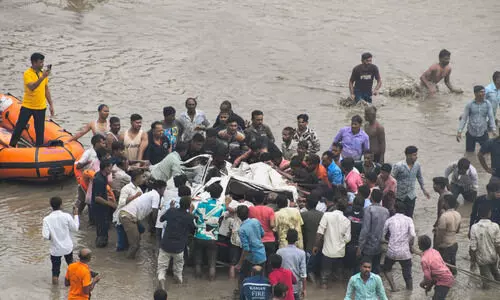 Eight killed as vehicles fall into river after bridge collapse in Vadodara