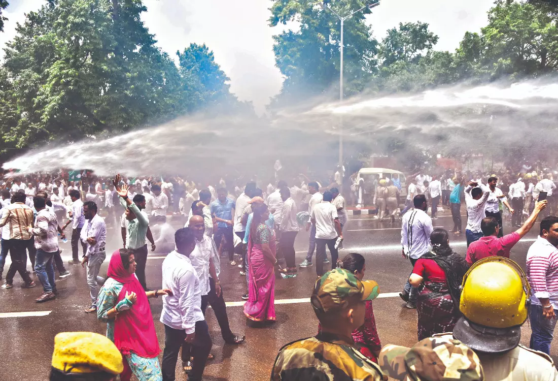 Scuffle in BJD’s protest, police use water cannons, fire tear gas shells Scuffle in BJD’s protest, police use water cannons, fire tear gas shells