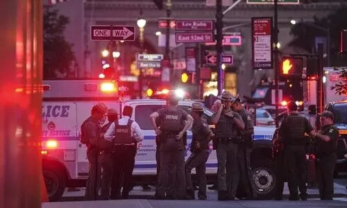 Gunman kills 4, including police officer, in shooting at New York City office tower