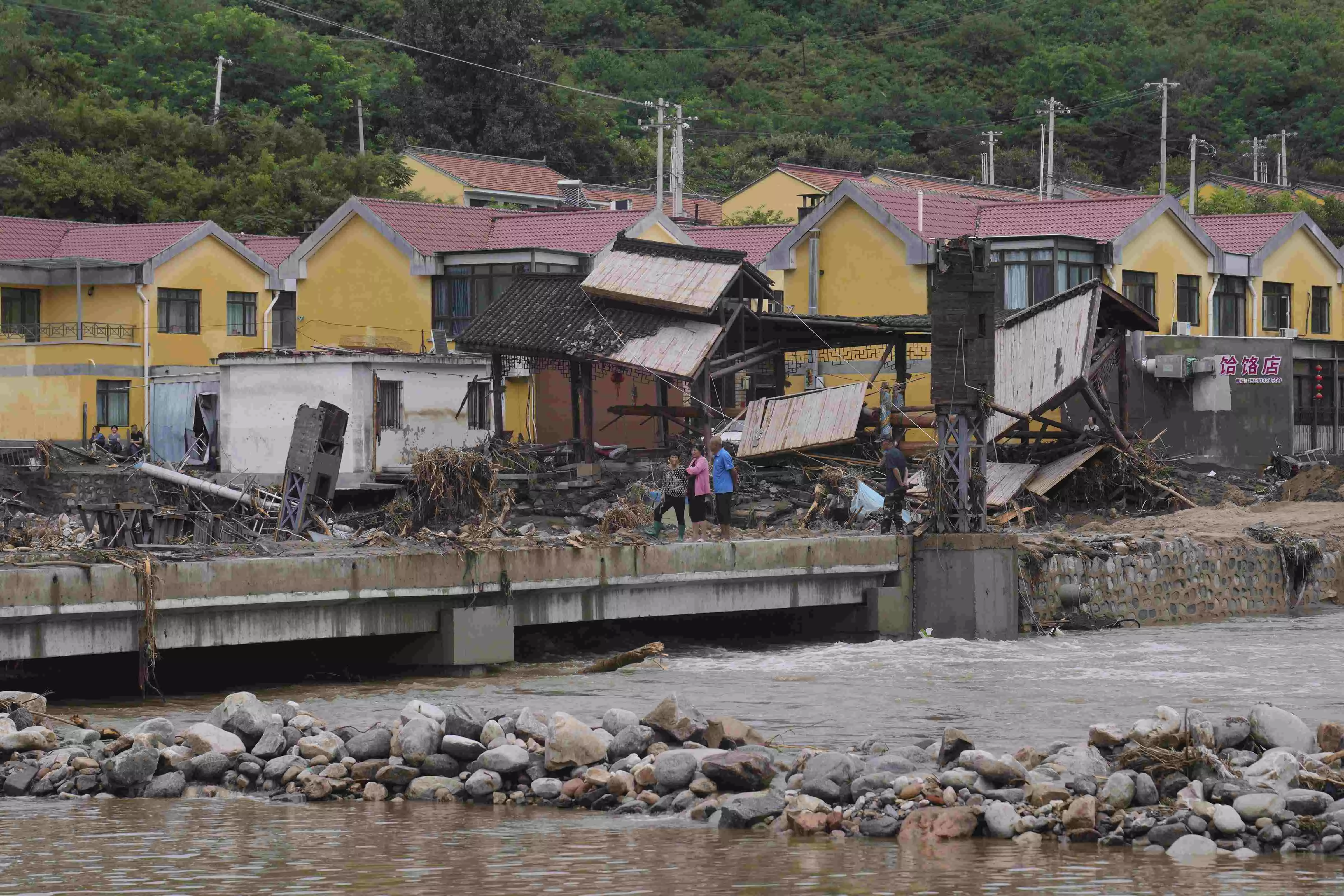 30 killed in heavy rain, floods in Beijing; China launches all-out relief efforts 30 killed in heavy rain, floods in Beijing; China launches all-out relief efforts