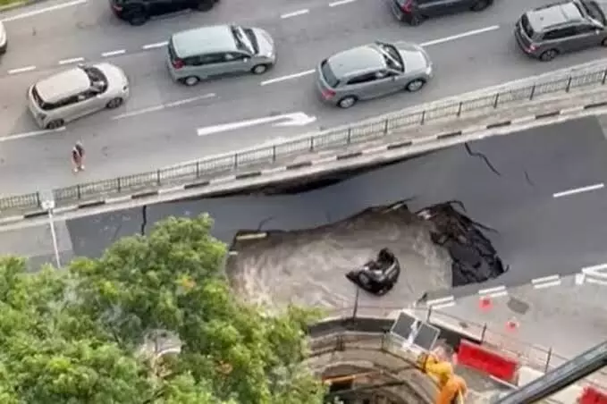 Singapore President to host 7 Indian workers who rescued woman from sinkhole Singapore President to host 7 Indian workers who rescued woman from sinkhole