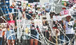 Hamas says it will allow aid for hostages if Israel halts strikes