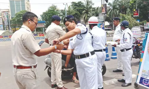 Lake Town traffic guard use rakhis to promote   road safety