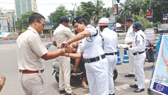 Lake Town traffic guard use rakhis to promote   road safety