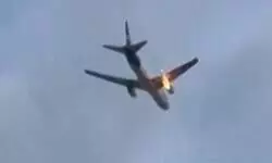 Fire erupts on cargo flight engine; aircraft lands safely, none injured